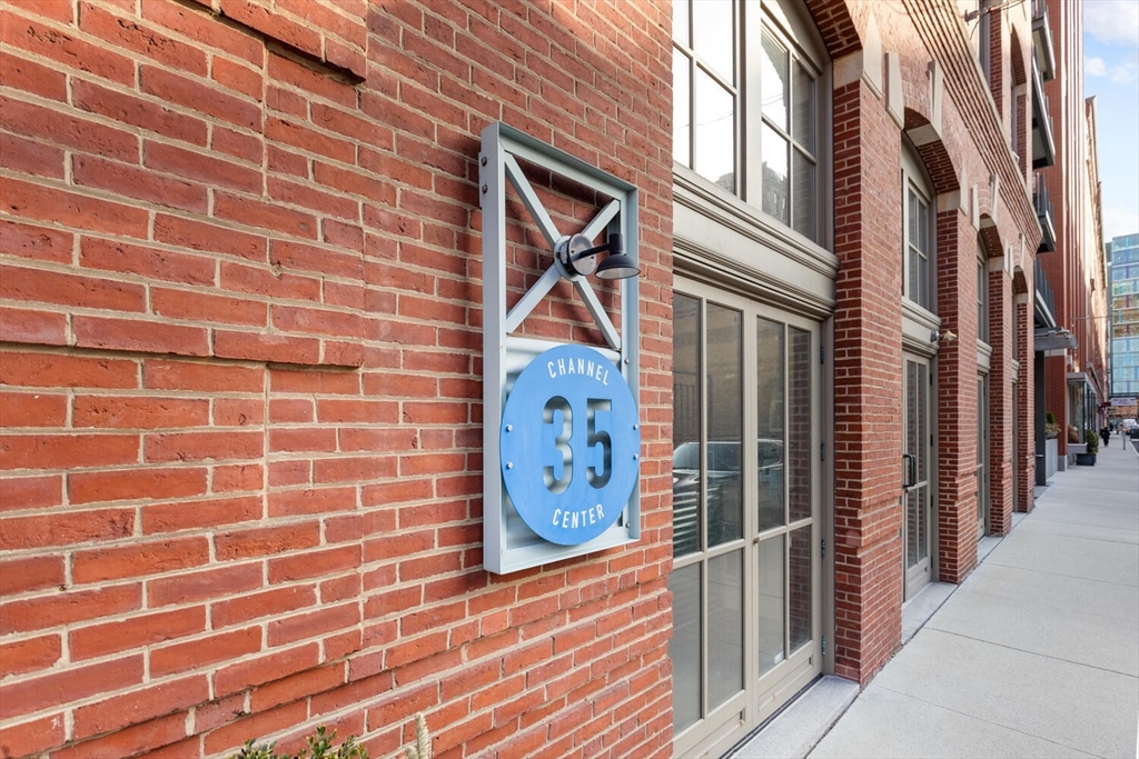 35 Channel Center Street, Unit 402 Boston, MA 02210 - Photo 32 of 35 a view of a brick buildings with entryway doors