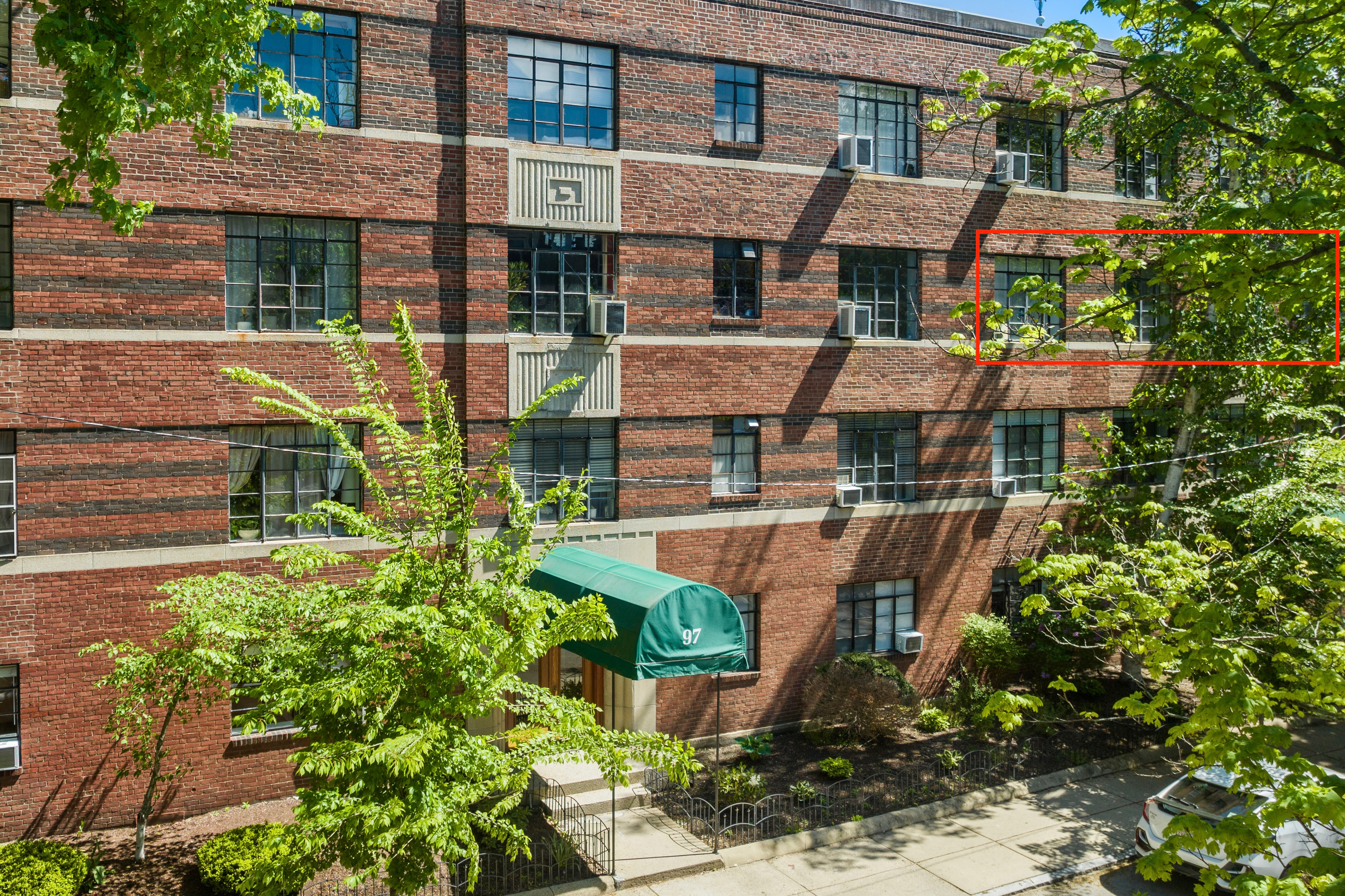 93 Strathmore Road, Unit 8 Brighton, MA 02135 - Photo 10 of 16 a aerial view of a house with a yard and potted plants