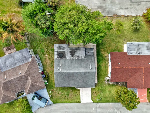 an aerial view of a house with a garden