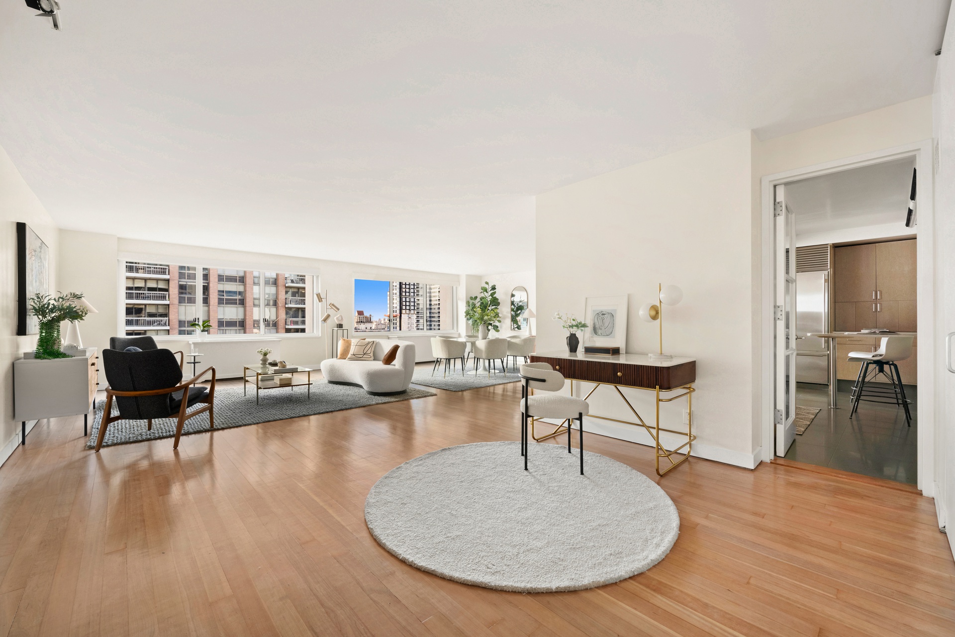 300 East 59th Street, Unit 2103 Manhattan, NY 10022 - Photo 6 of 14 a living room with furniture and a table