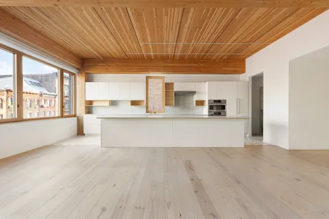 a kitchen with stainless steel appliances a sink and a window