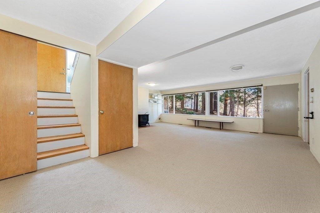 5 Field Road Lexington, MA 02421 - Photo 9 of 17 a view of an empty room with a window