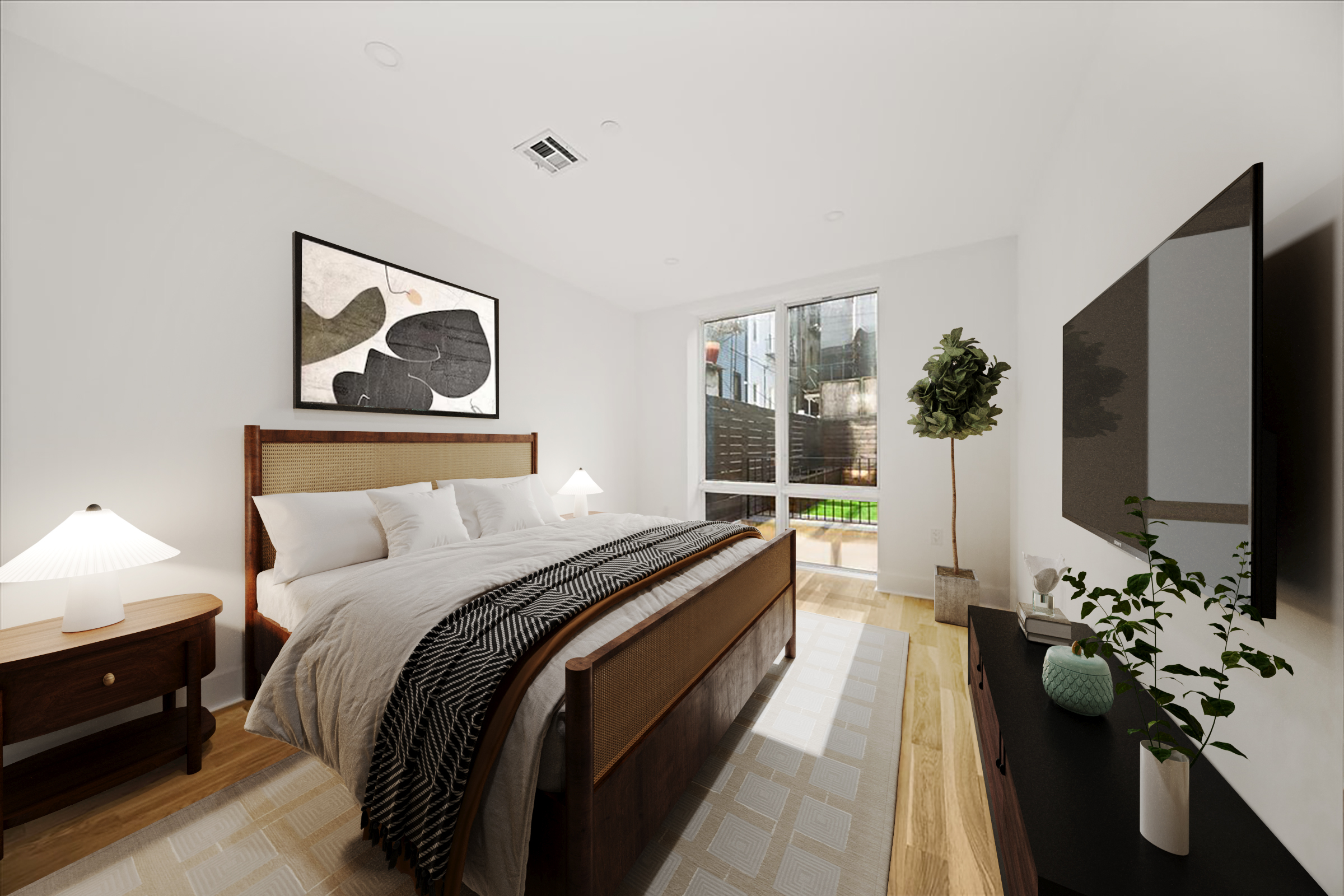 40 Schaefer Street, Unit 1B Brooklyn, NY 11207 - Photo 3 of 10 a bedroom with a bed and a flat screen tv