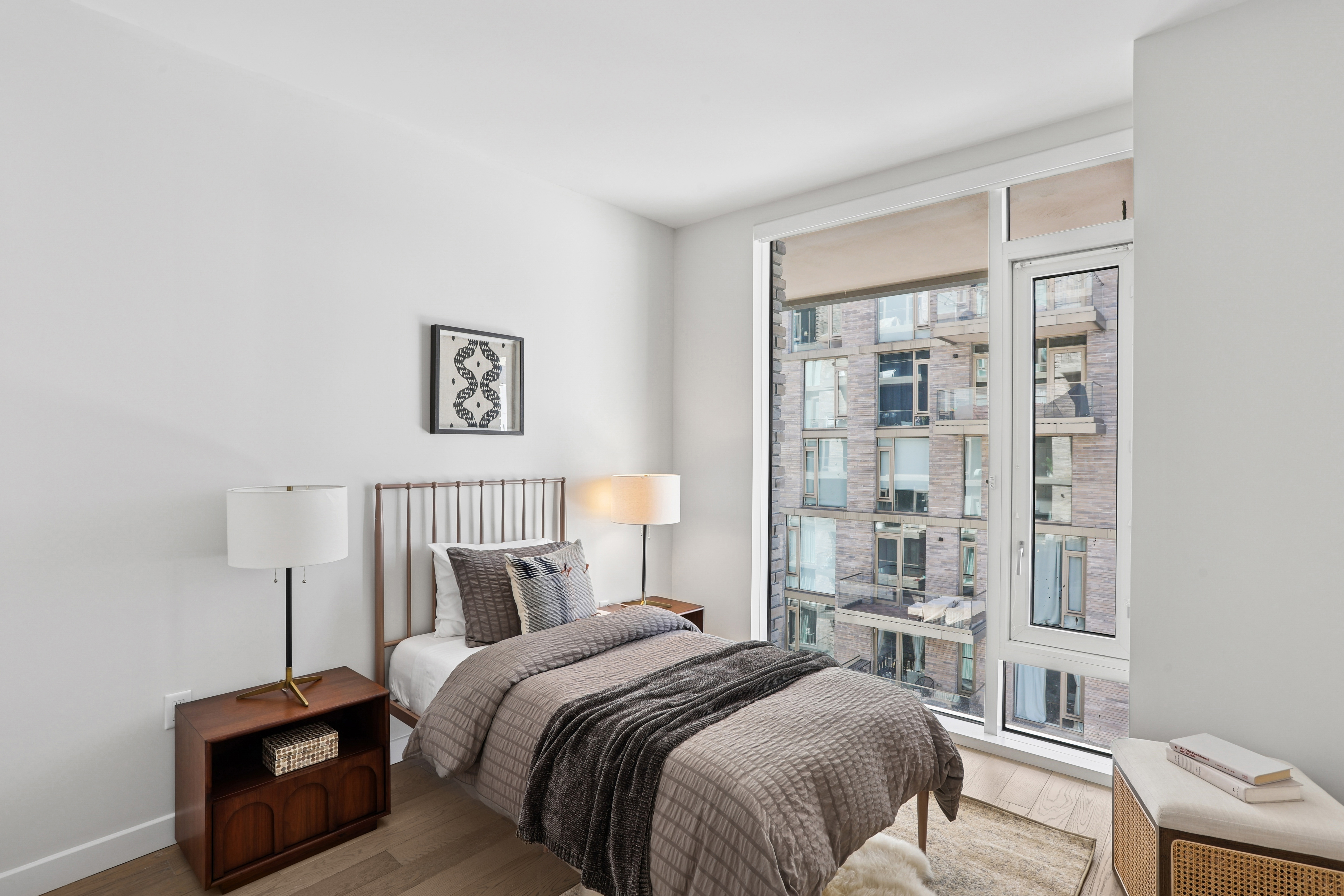 505-513 West 43rd Street, Unit 10B Manhattan, NY 10036 - Photo 10 of 22 a bed room with a bed and a window