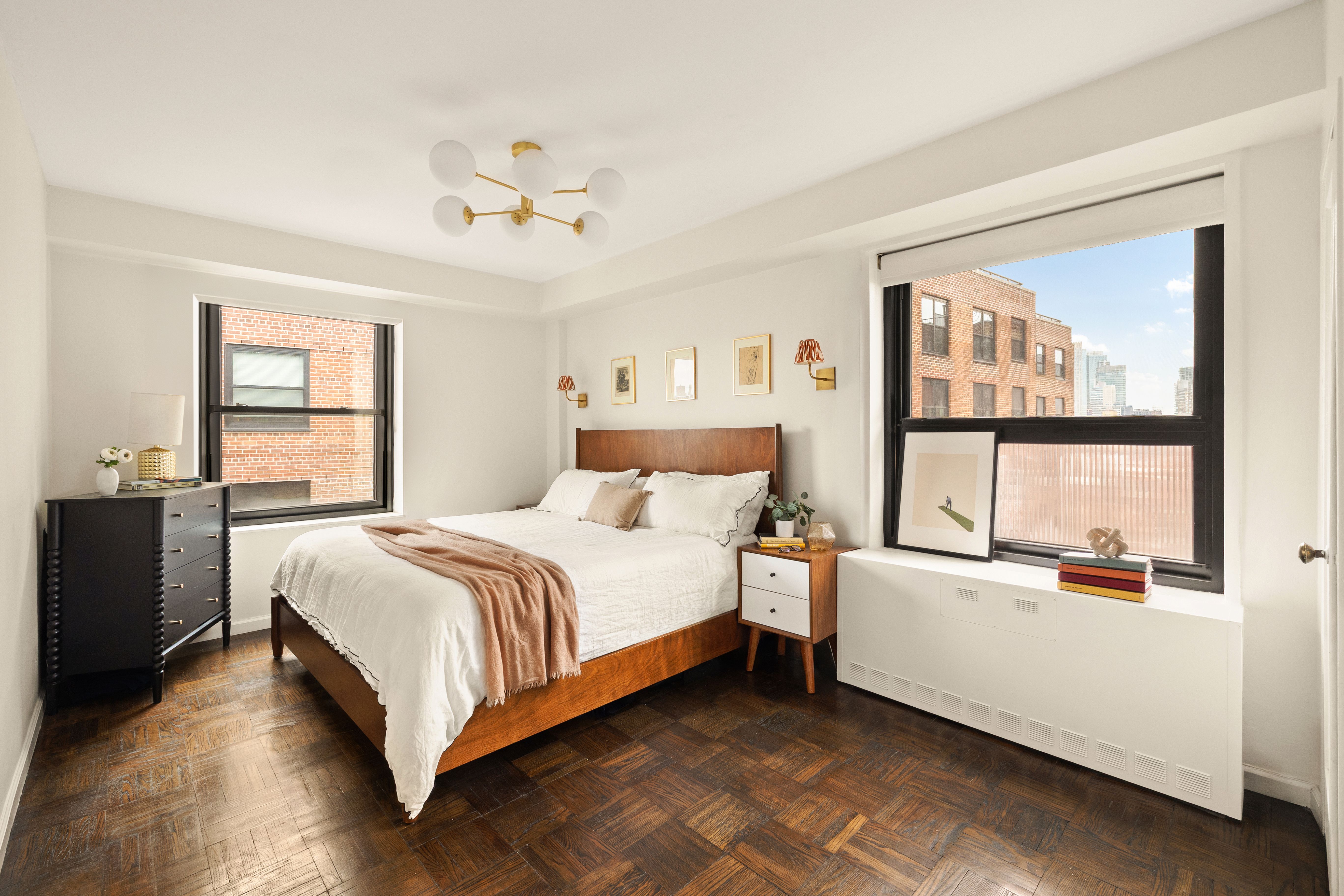 205 Clinton Avenue, Unit 12G Brooklyn, NY 11205 - Photo 5 of 8 a bedroom with a bed and a large window