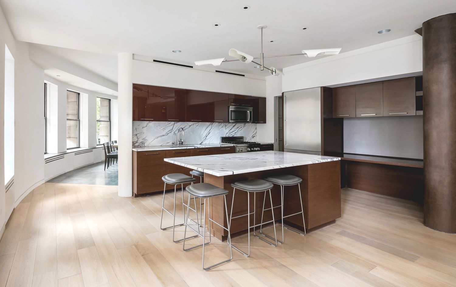 260 West Broadway, Unit 2/3B Manhattan, NY 10013 - Photo 9 of 21 a kitchen with kitchen island a sink stainless steel appliances and a counter top space