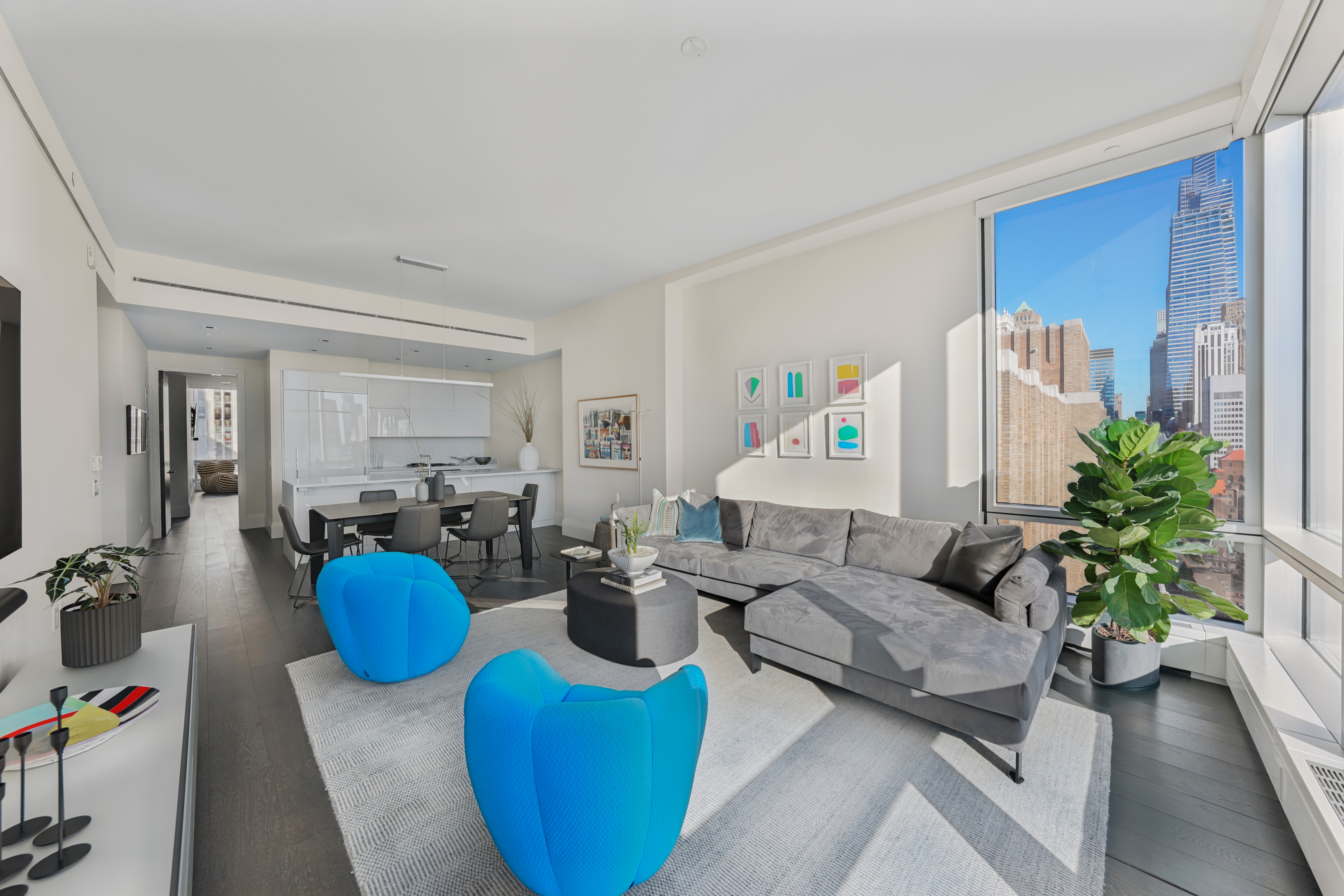 172 Madison Avenue, Unit 24B Manhattan, NY 10016 - Photo 1 of 16 a living room with furniture and a wooden floor