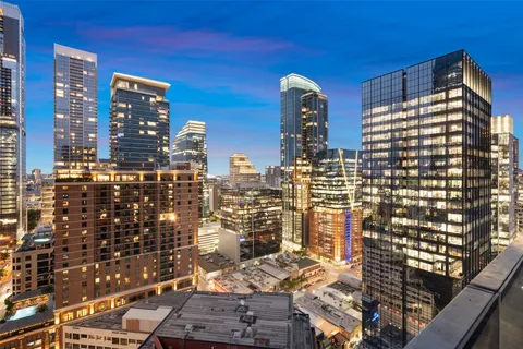 a view of swimming pool with outdoor seating