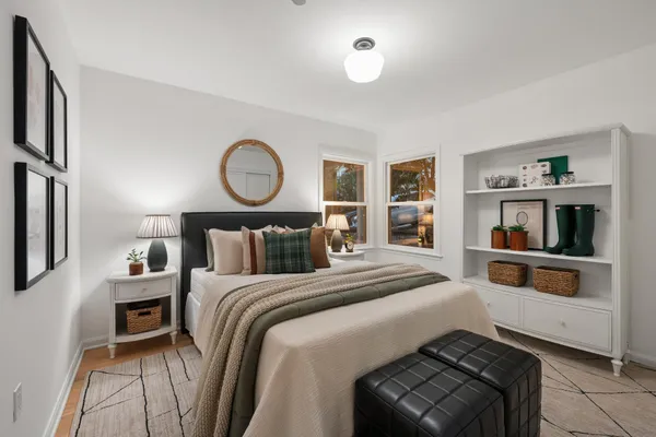 a bedroom with a bed and a cabinets