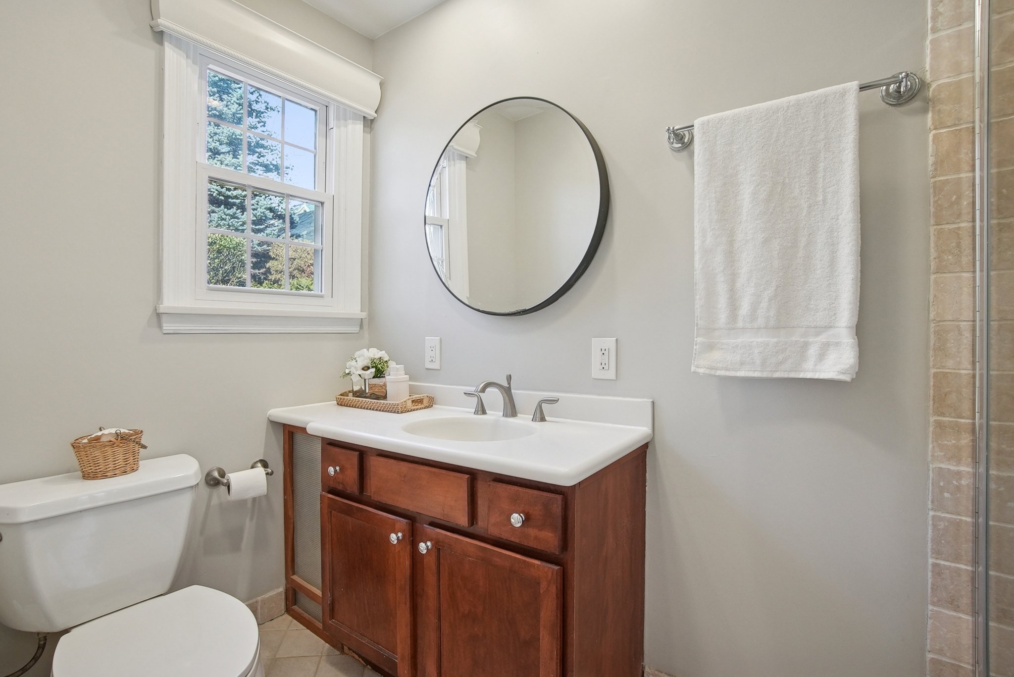 877 Ridgewood Road Millburn, NJ 07041 - Photo 15 of 37 a bathroom with a toilet a sink and a mirror