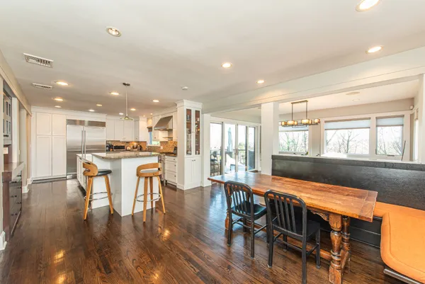 a view of a dining room with furniture window and wooden floor