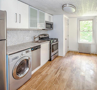 99 Butler Street, Unit 2 Brooklyn, NY 11231 - Photo 1 of 5 a kitchen with a stove a sink and a refrigerator