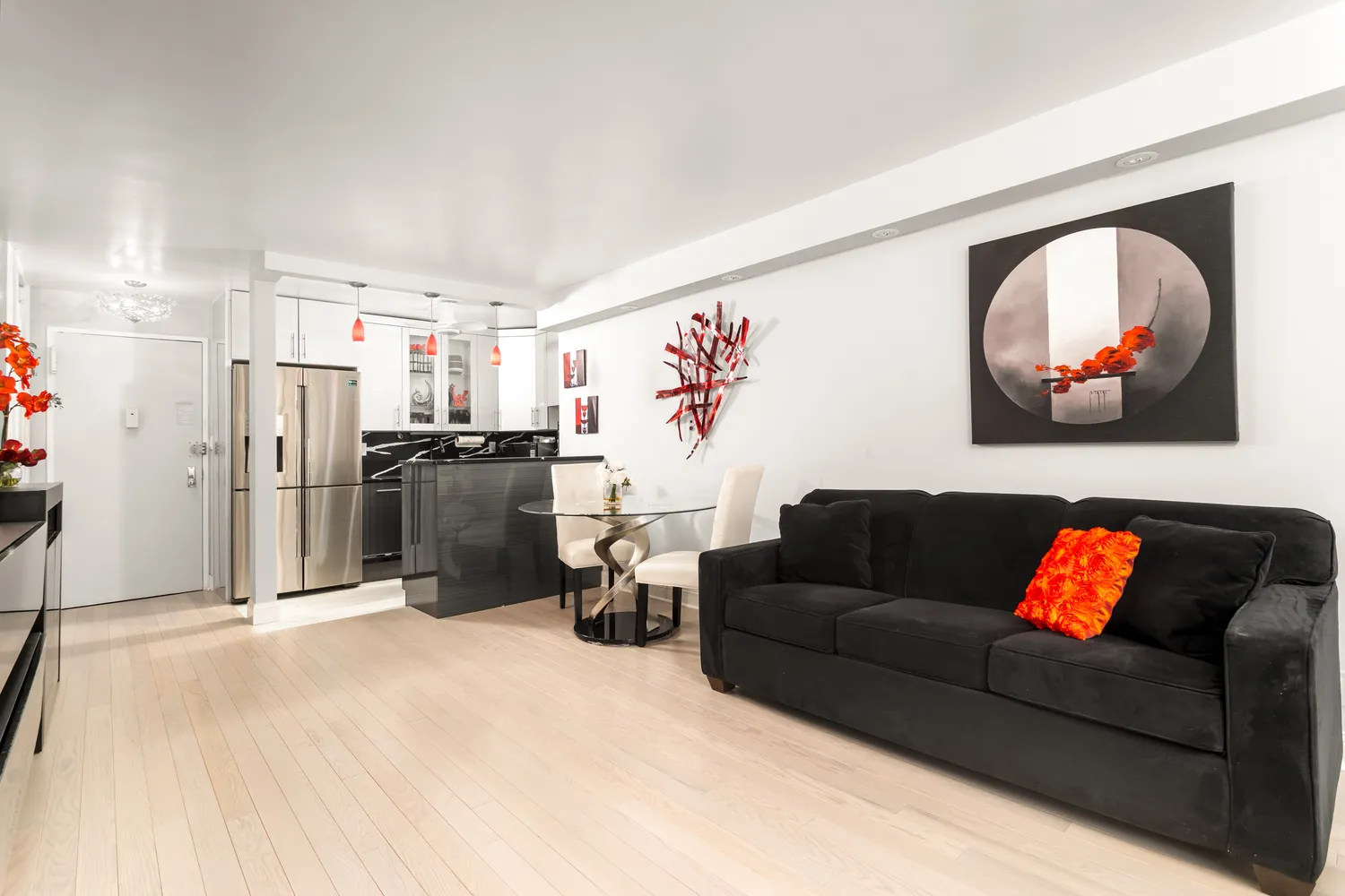 a living room with furniture and kitchen view