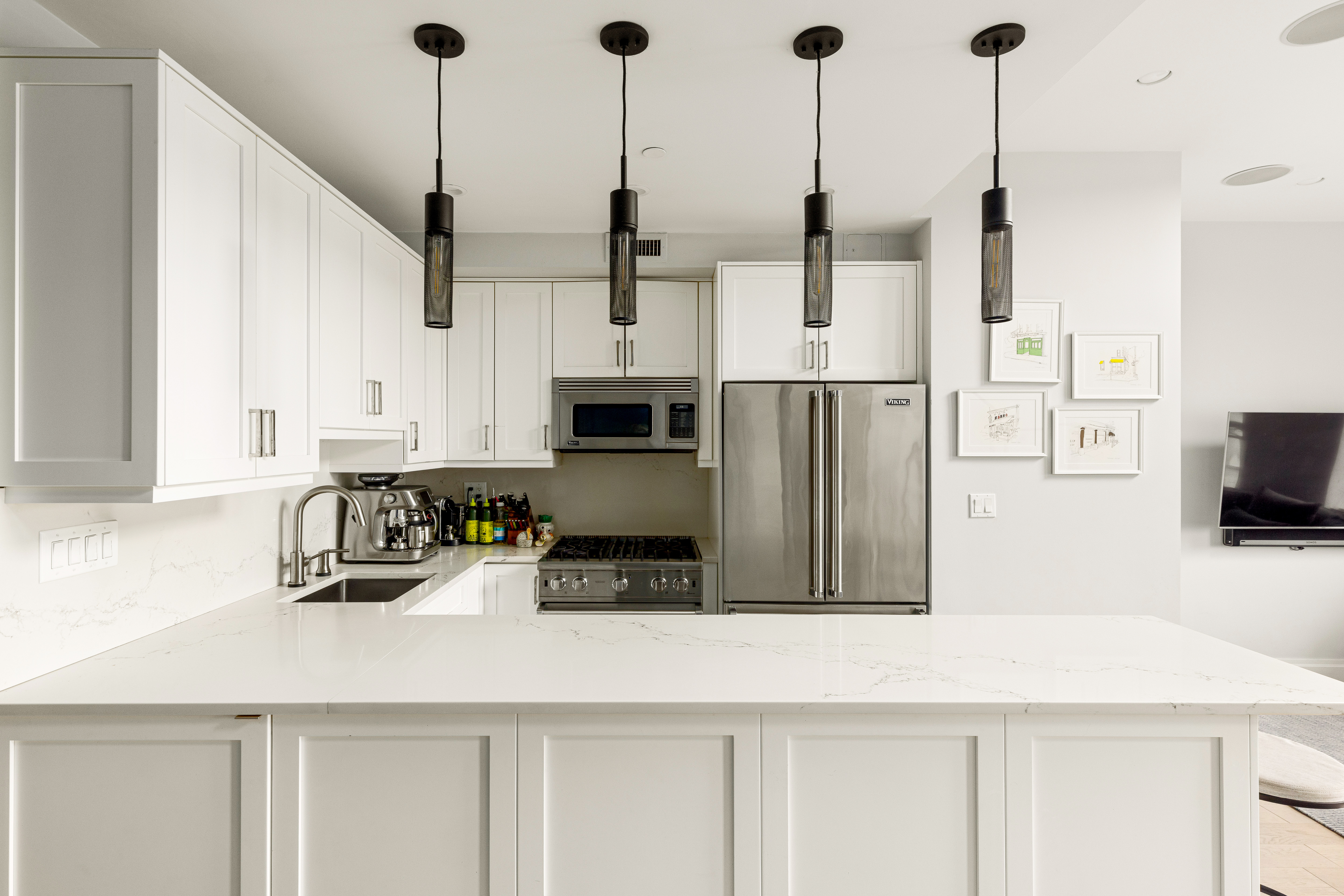 353 3rd Street, Unit B5B Brooklyn, NY 11215 - Photo 4 of 22 a kitchen with stainless steel appliances kitchen island granite countertop a refrigerator a oven and white cabinets