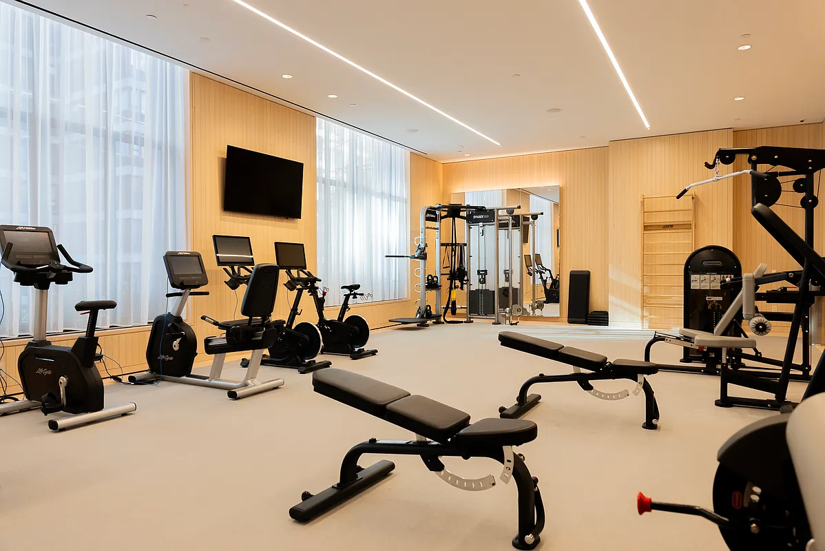 430 East 58th Street, Unit 38A Manhattan, NY 10022 - Photo 12 of 22 a view of a room with gym equipment