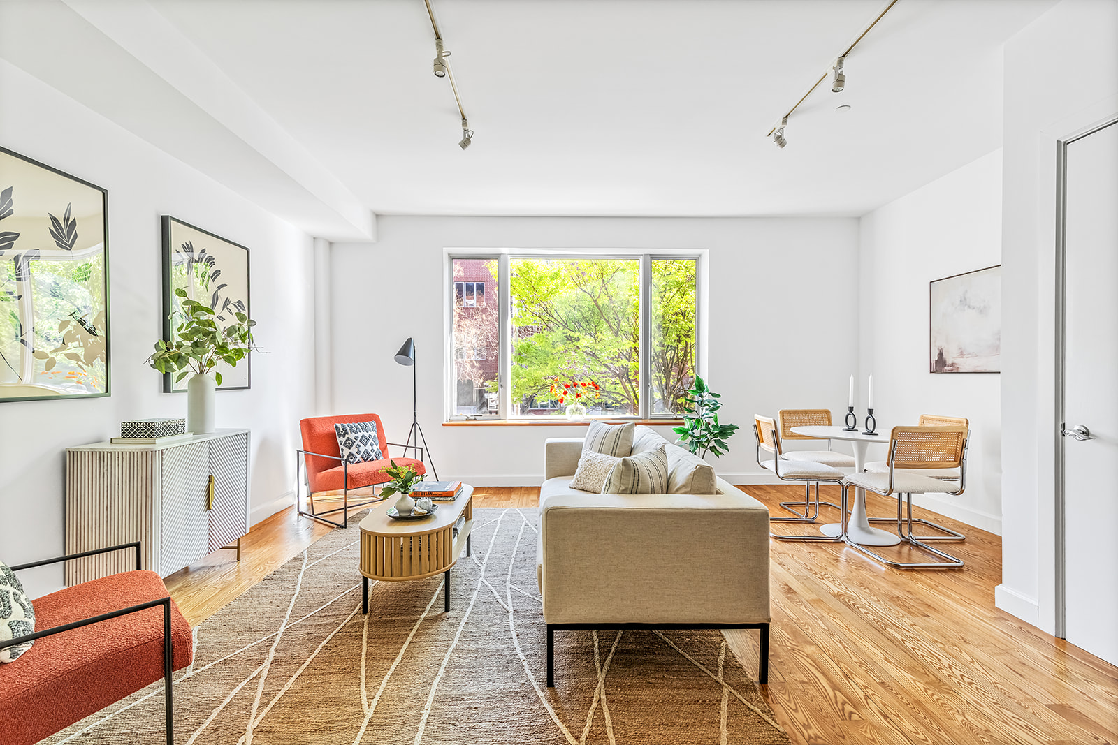 372 15th Street, Unit 2A Brooklyn, NY 11215 - Photo 2 of 10 a living room with furniture and a large window
