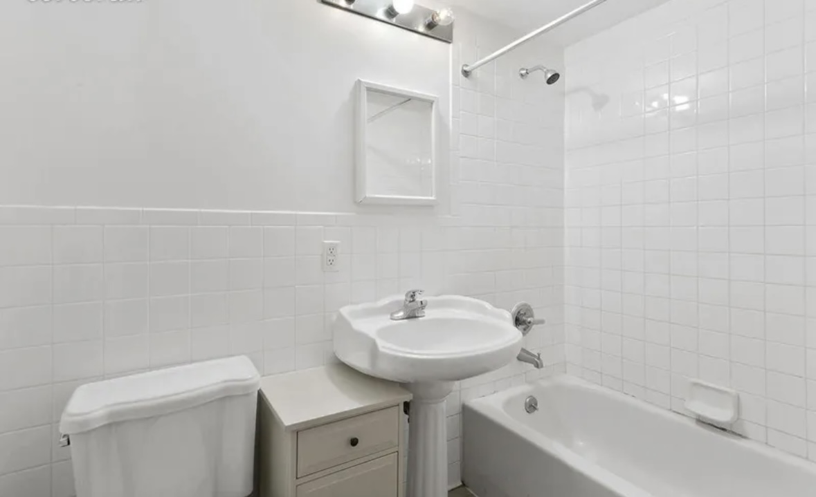 137 West 126th Street, Unit 3 Manhattan, NY 10027 - Photo 5 of 5 a bathroom with a sink a toilet and shower