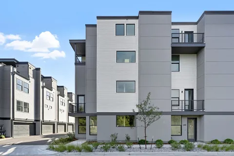 a front view of a multi story residential apartment building