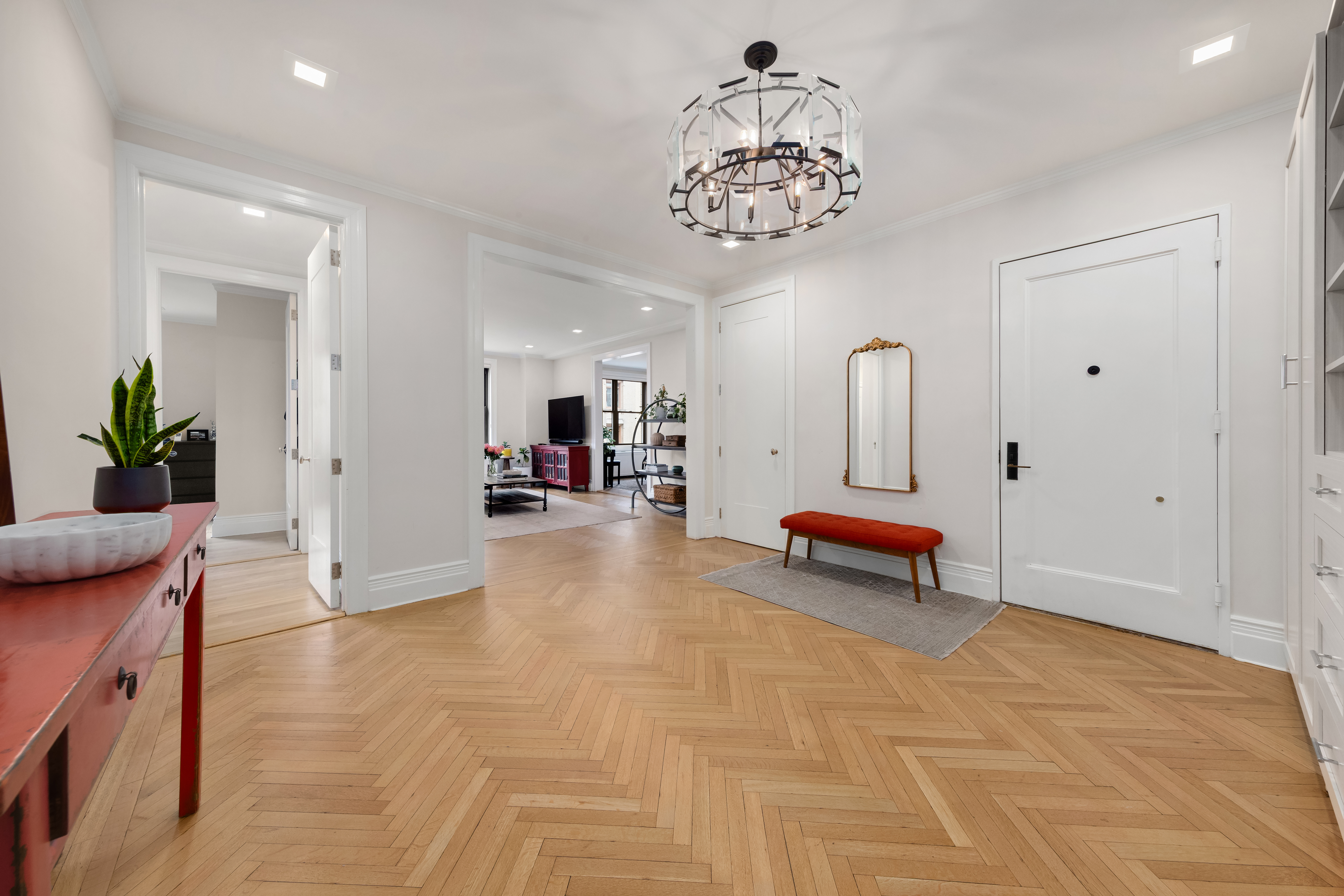 a view of a livingroom with furniture and a chandelier