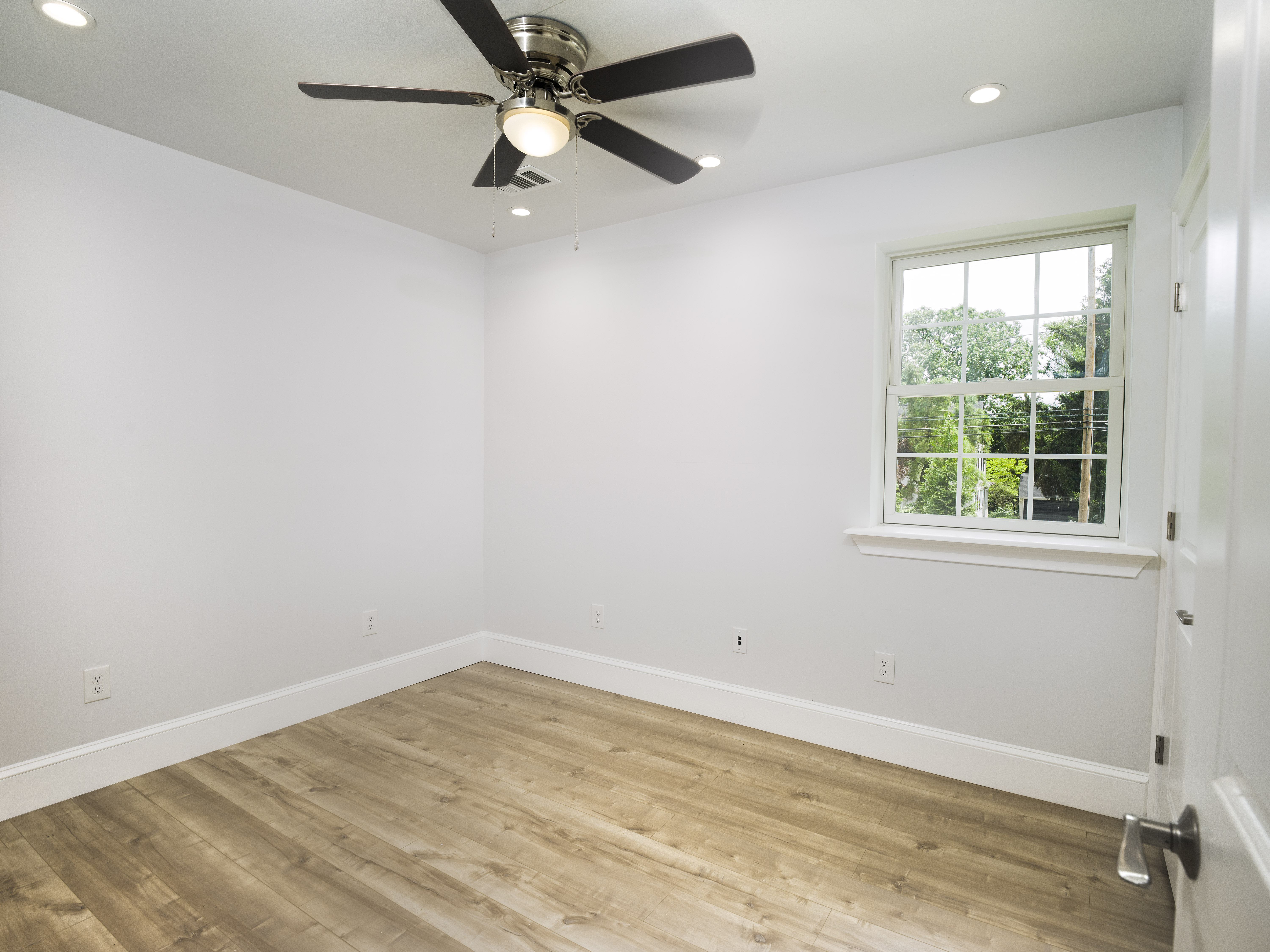 319 West Conestoga Road Devon, PA 19333 - Photo 28 of 38 an empty room with a window and a fan