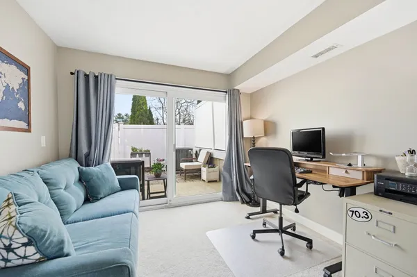 a living room with furniture or couch and a flat screen tv