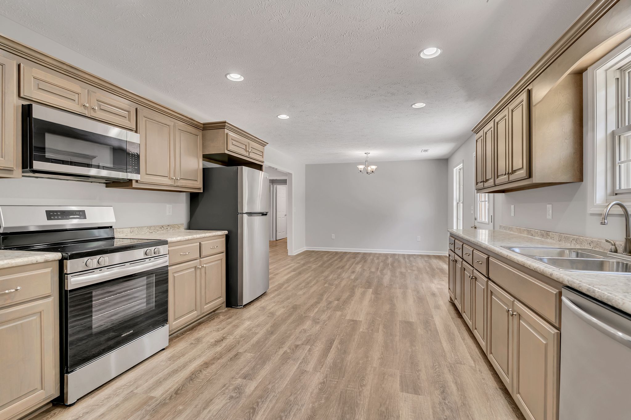 585 Paynes Church Road Estill Springs, TN 37330 - Photo 15 of 34 a kitchen with stainless steel appliances granite countertop a stove a sink and a refrigerator