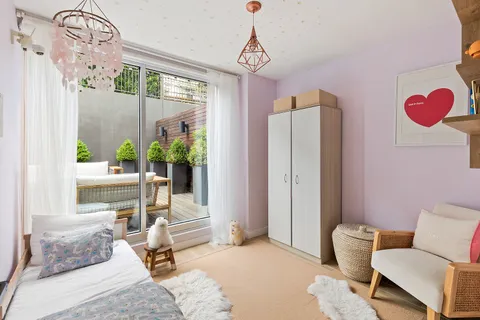 a living room with furniture and a window