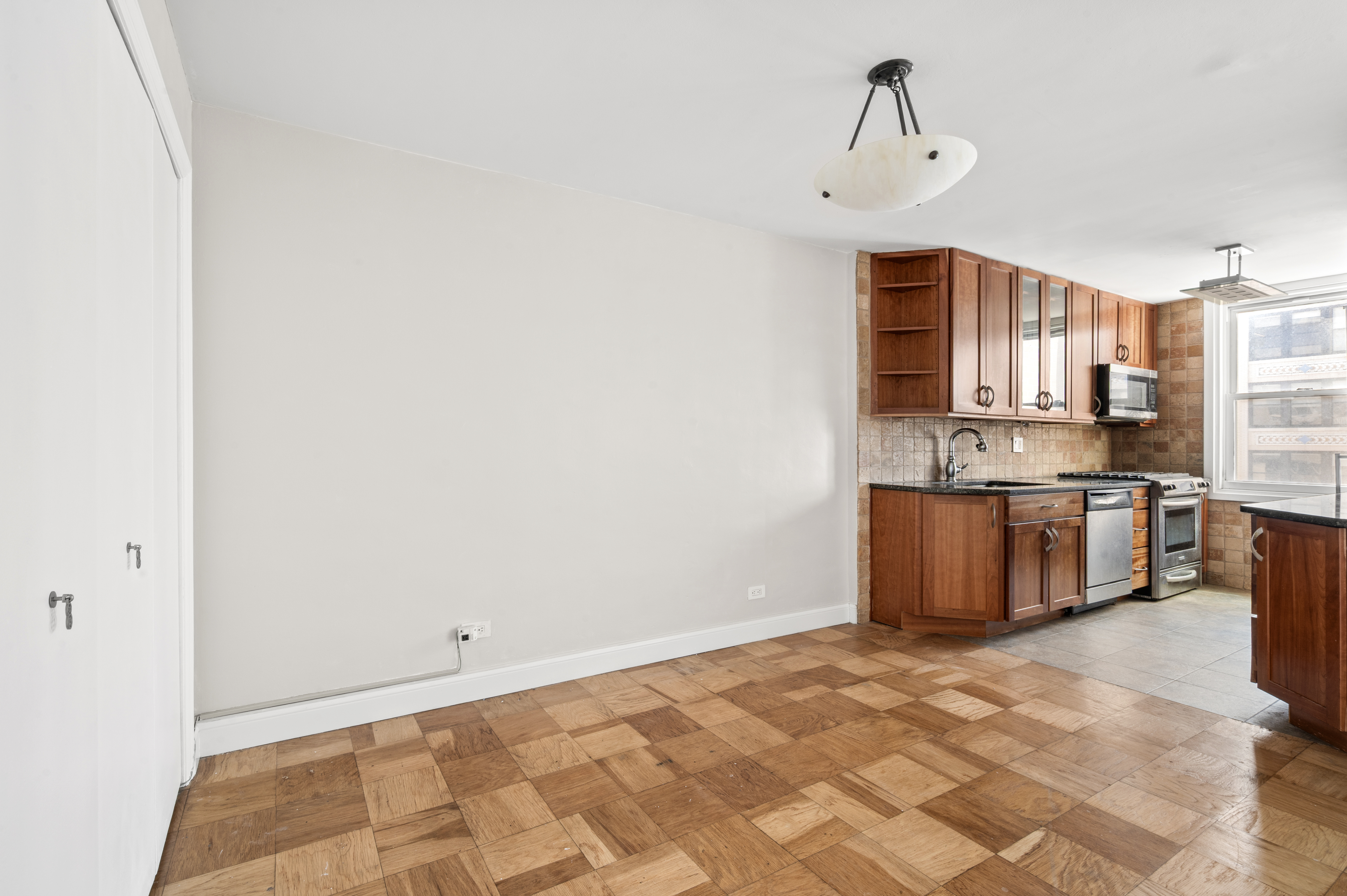 77 7th Avenue, Unit 10N Manhattan, NY 10011 - Photo 4 of 13 a view of kitchen with sink