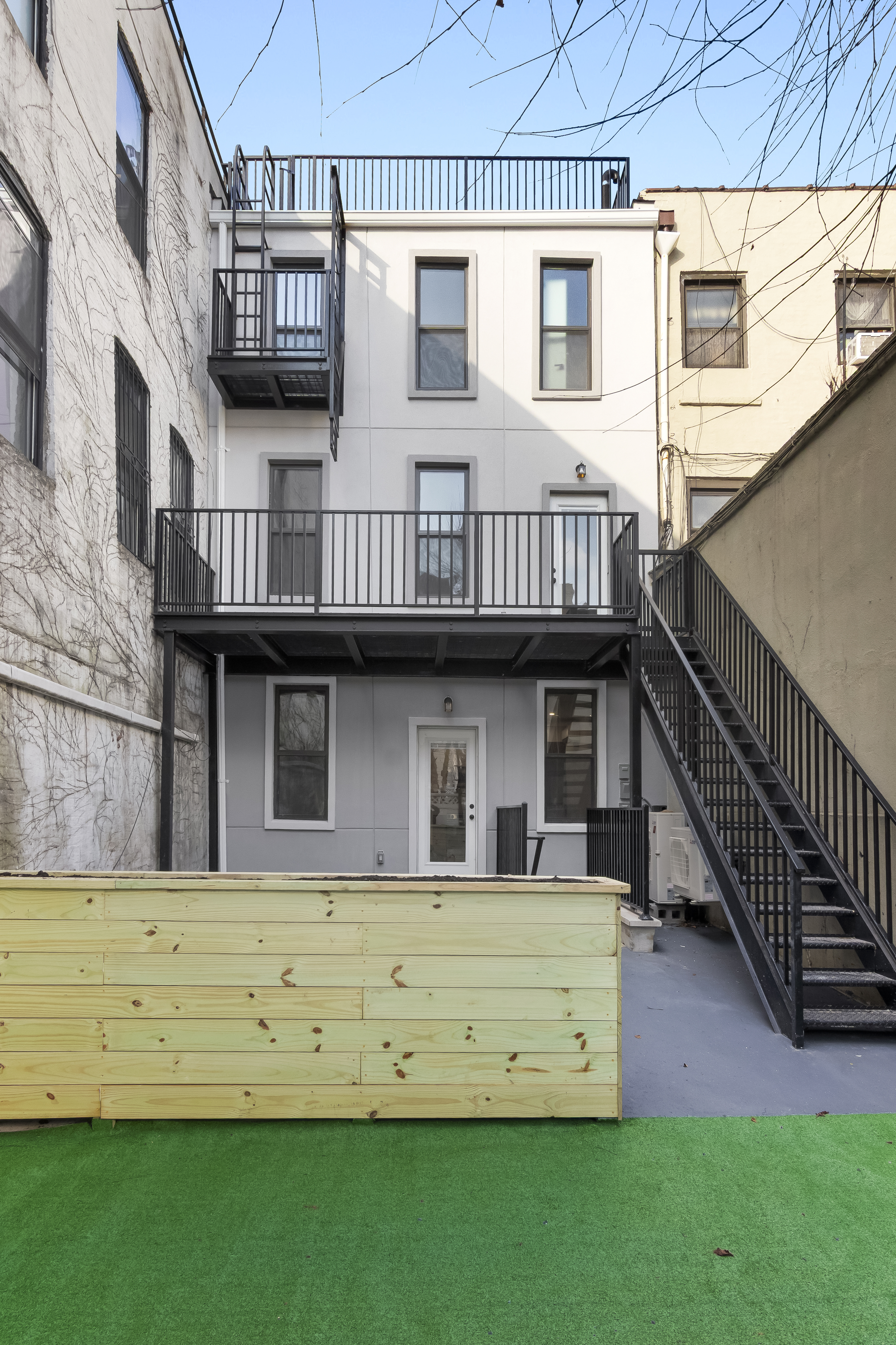 297 3rd Avenue, Unit 1 Brooklyn, NY 11215 - Photo 7 of 8 a view of a house with a yard