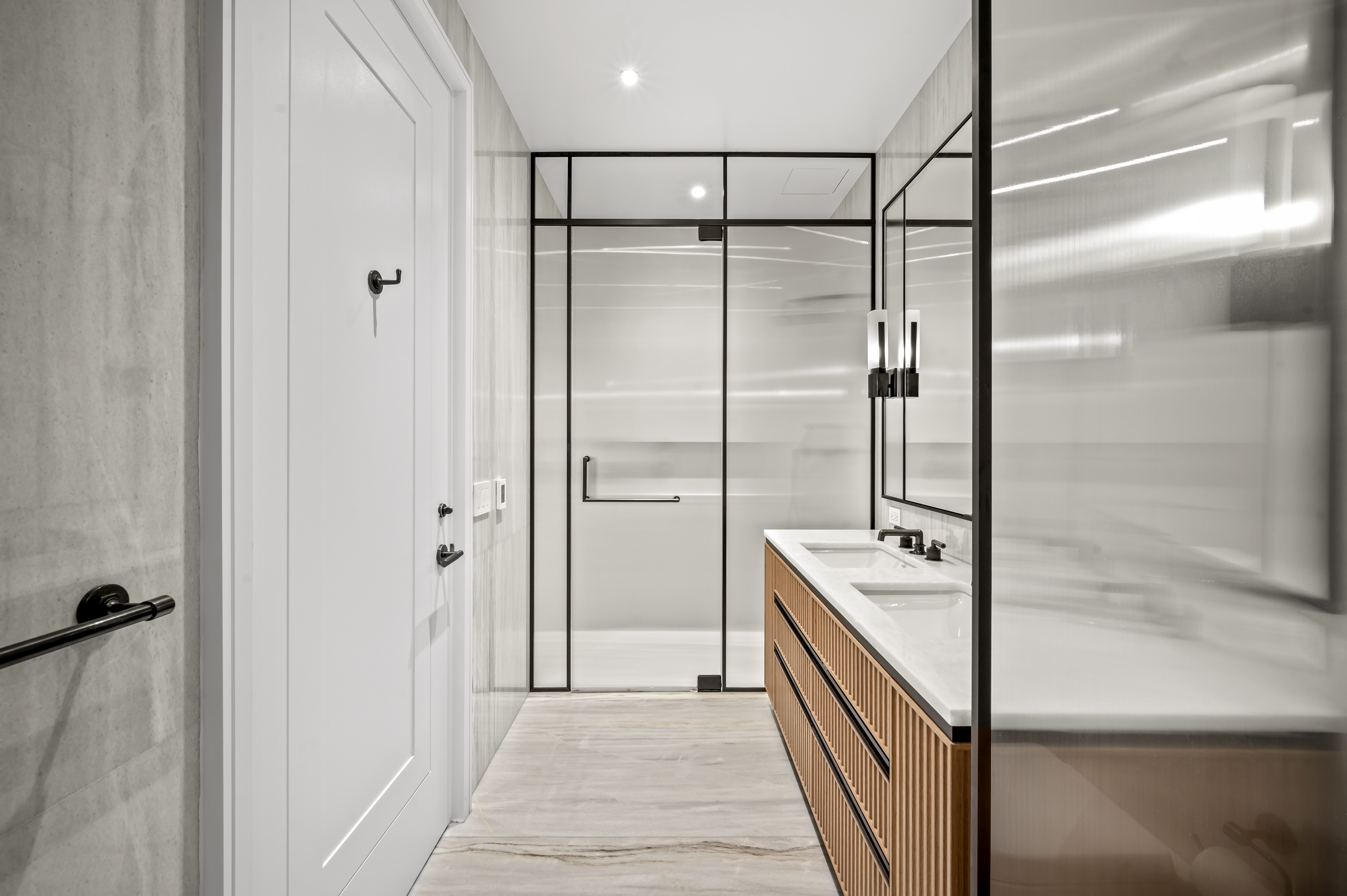 515 West 18th Street, Unit 1401 Manhattan, NY 10011 - Photo 9 of 12 a bathroom with a shower and a sink