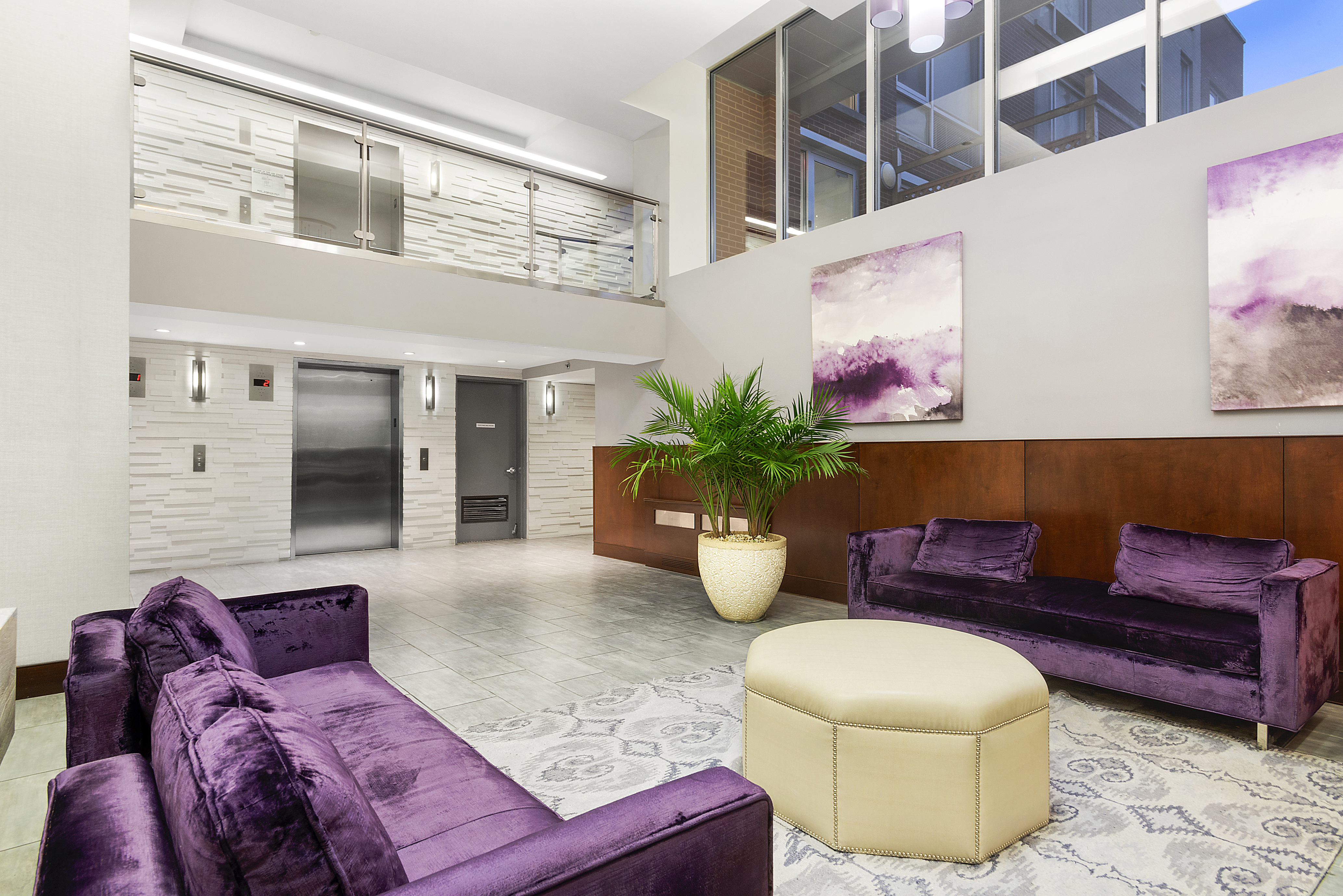 2-40 51st Avenue, Unit 2N Queens, NY 11101 - Photo 9 of 12 a living room with furniture flowerpot and window