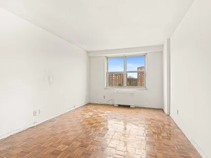 a view of an empty room with a window