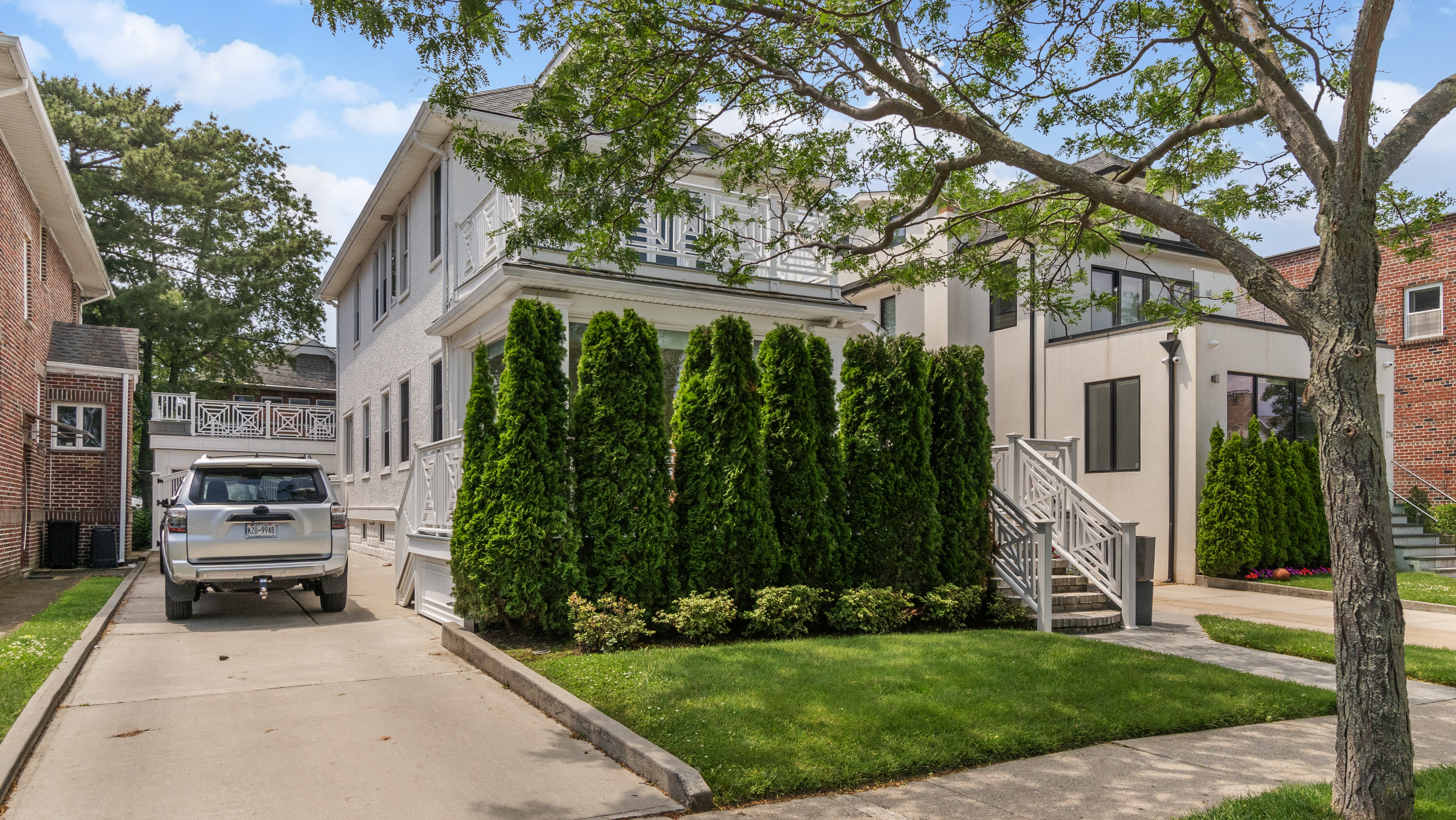 278 Amherst Street Brooklyn, NY 11235 - Photo 24 of 24 a view of a house with backyard and a tree