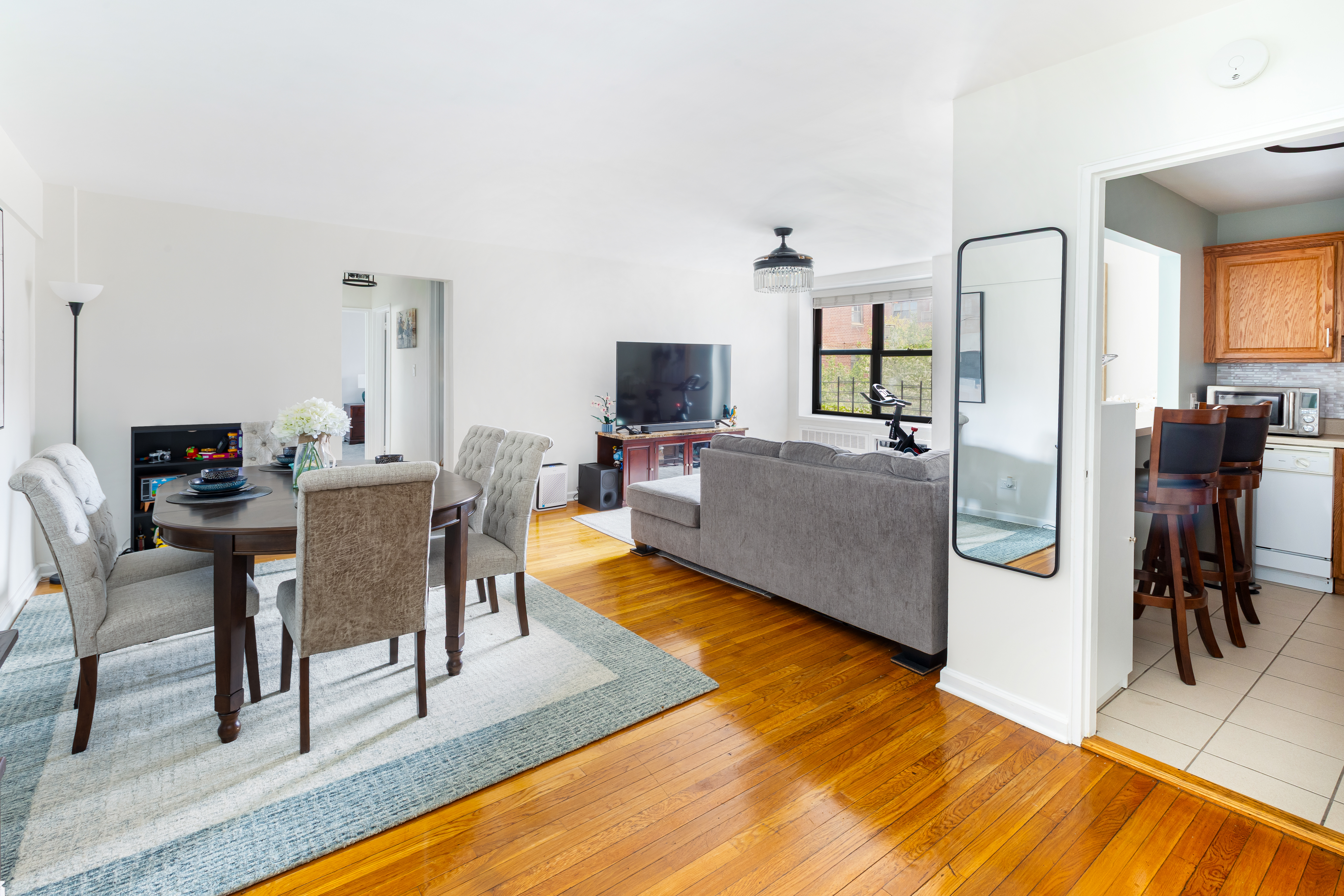 1270 East 51st Street, Unit 5B Brooklyn, NY 11234 - Photo 1 of 8 a living room with furniture and a flat screen tv