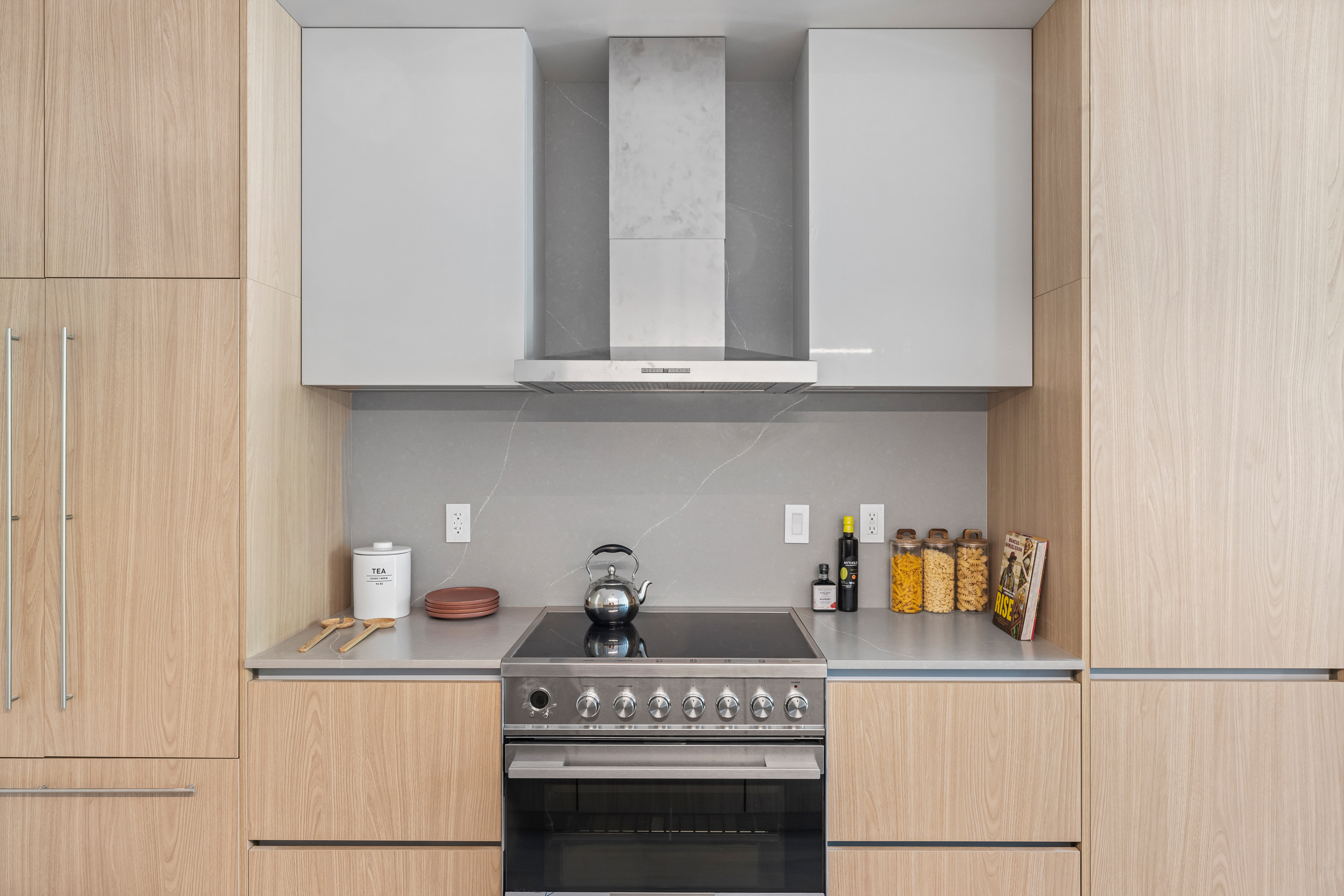 810 Sterling Place, Unit PH Brooklyn, NY 11216 - Photo 3 of 16 a kitchen with a stove and white cabinets