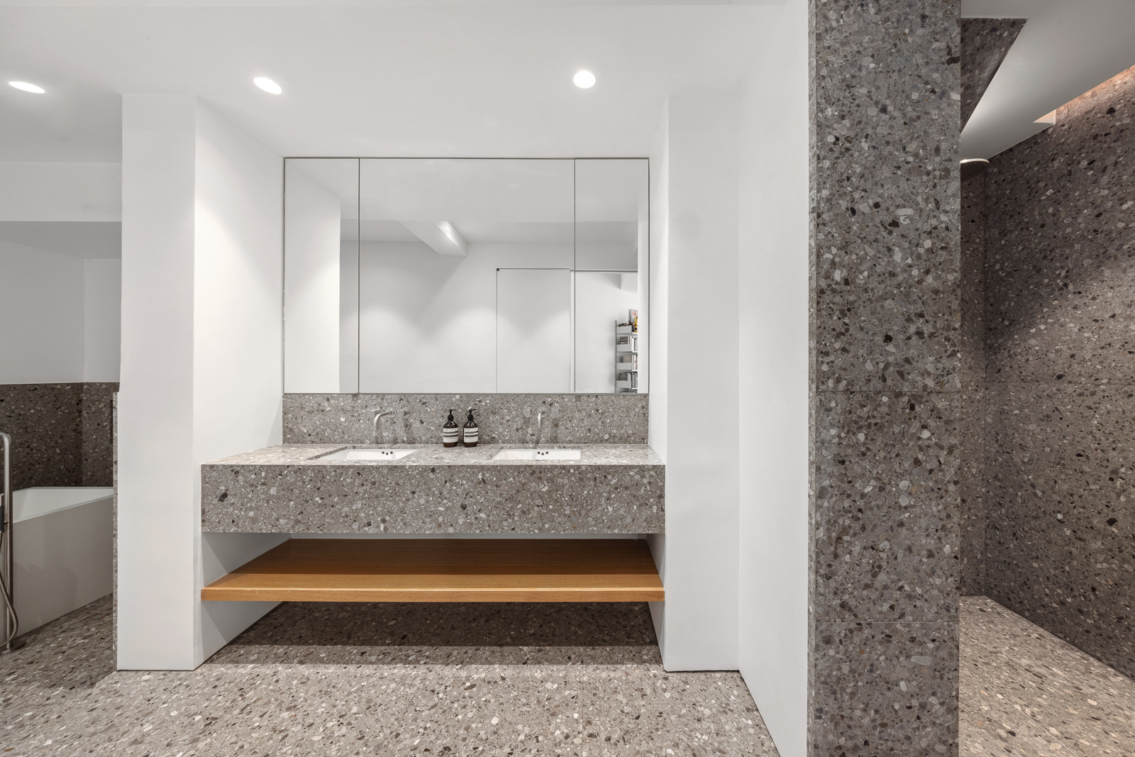 425 Park Avenue South, Unit 14CD Manhattan, NY 10016 - Photo 12 of 17 a bathroom with a granite countertop sink a mirror and shower