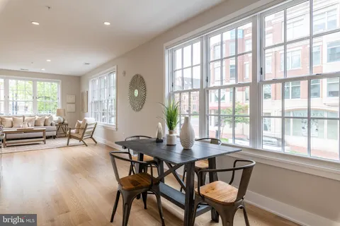 a view of a dining room with furniture window and outside view