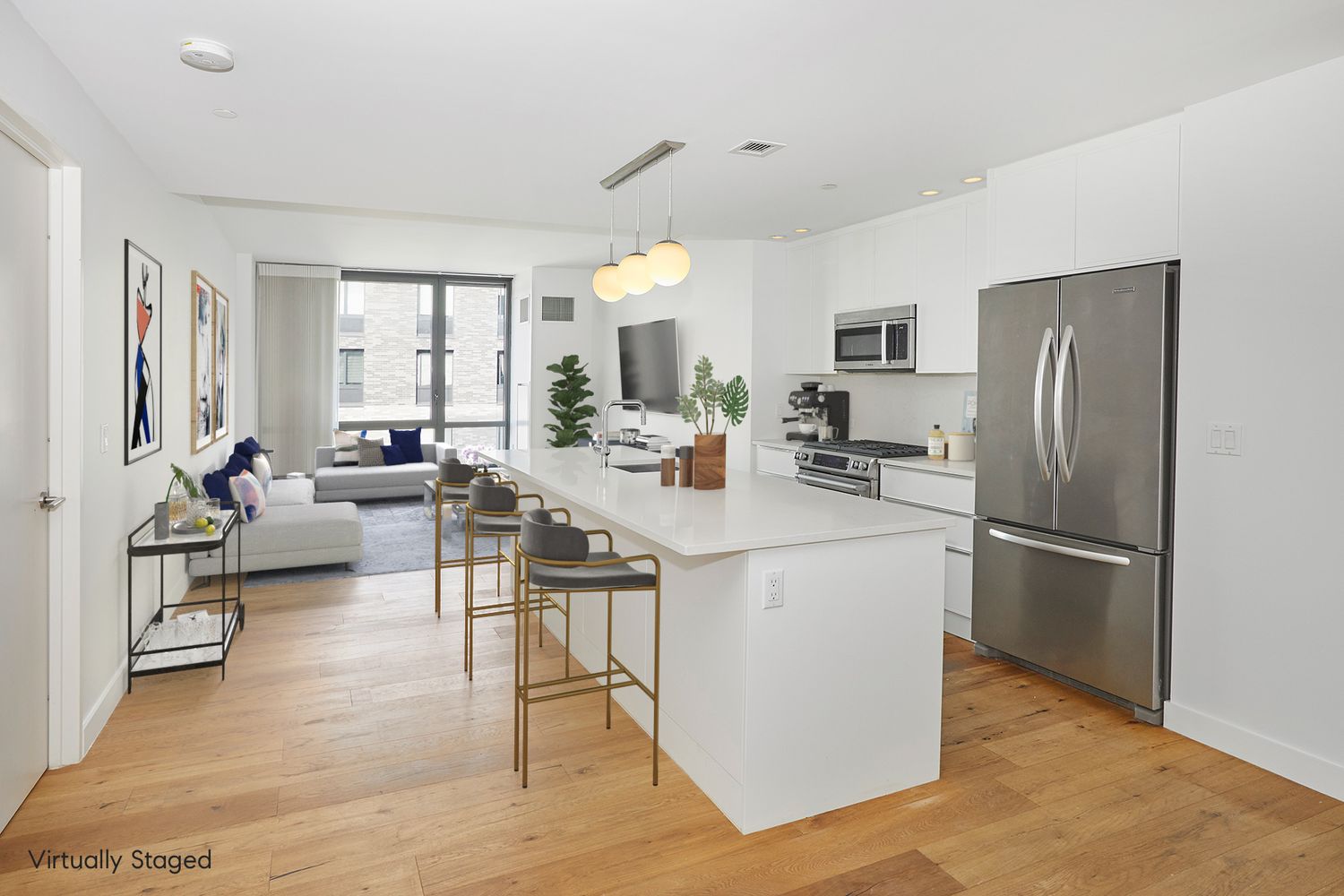 23 West 116th Street, Unit 8A Manhattan, NY 10026 - Photo 4 of 28 a kitchen with a refrigerator a stove cabinets and living room view