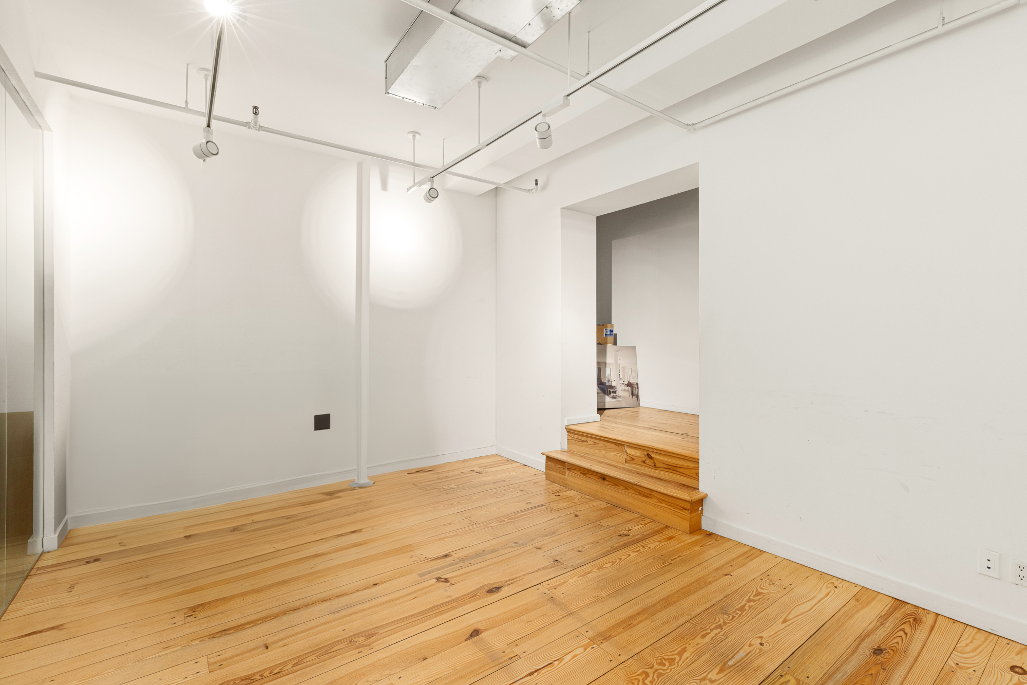 195 Bowery, Unit 2C Manhattan, NY 10002 - Photo 10 of 12 a bedroom with a bed and wooden floor