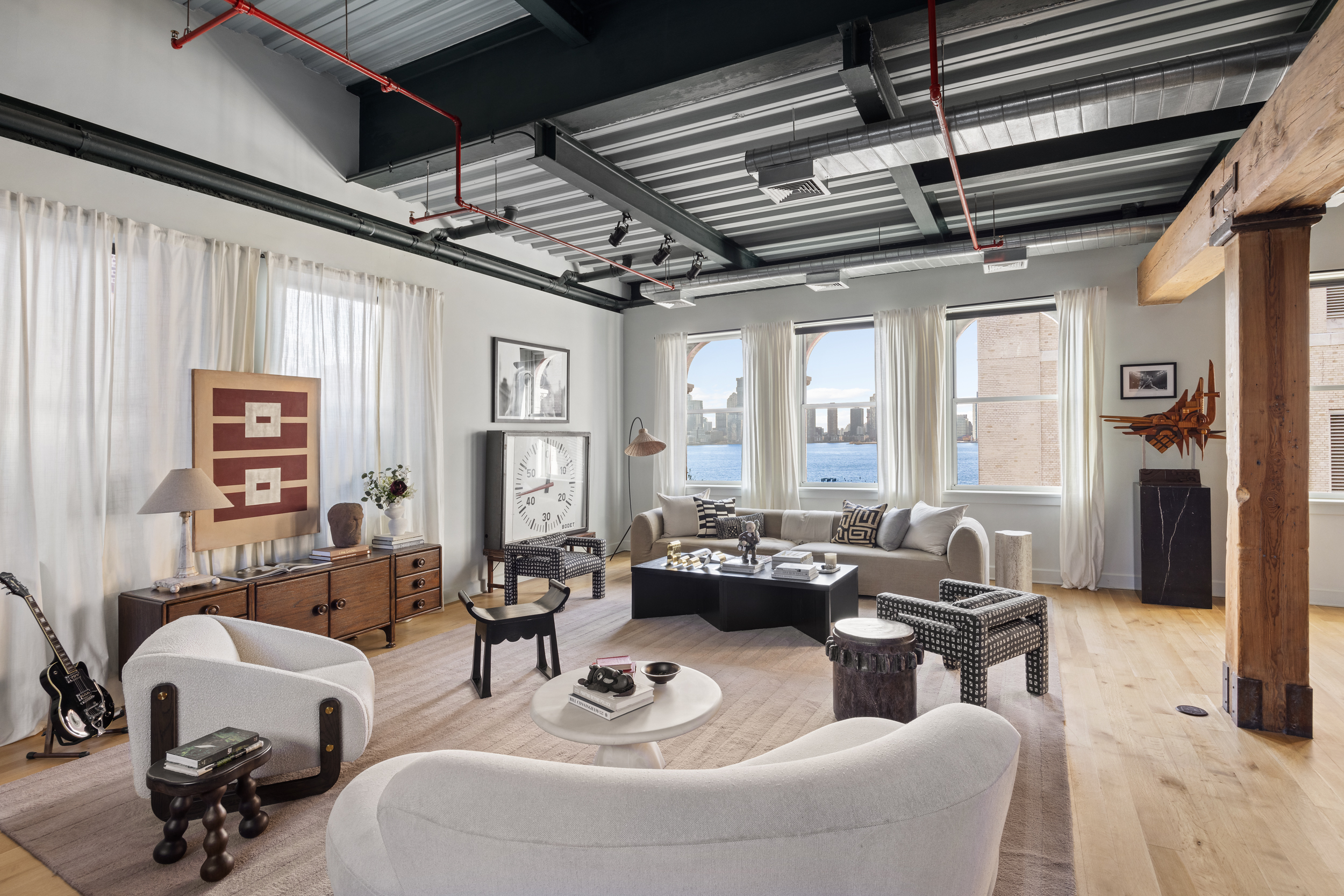 481 Washington Street, Unit PHS Manhattan, NY 10013 - Photo 2 of 20 a living room with furniture and a chandelier