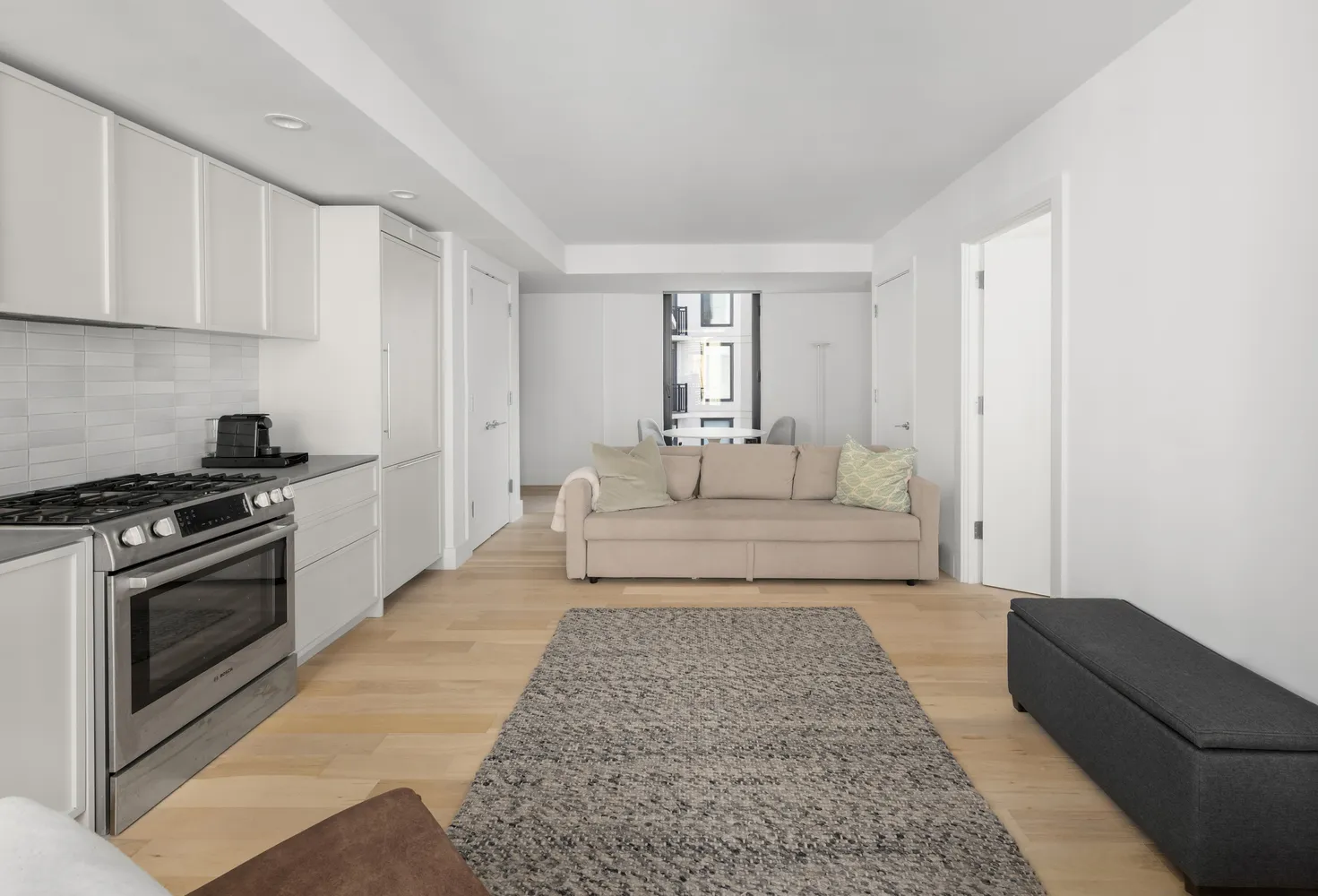 a spacious bedroom with a bed and a couch