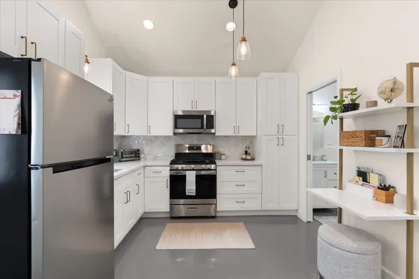 a view of a chairs and table in a patio
