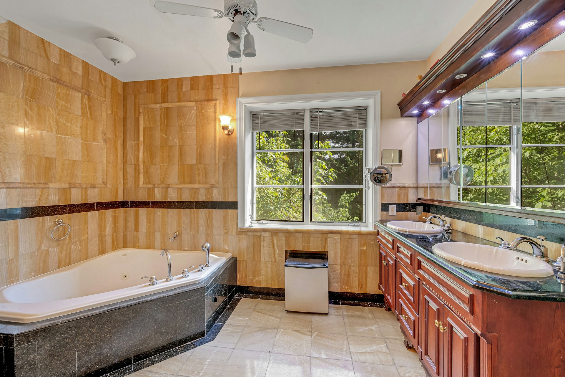 5440 Independence Avenue Bronx, NY 10471 - Photo 23 of 36 a bathroom with a tub a sink and large window