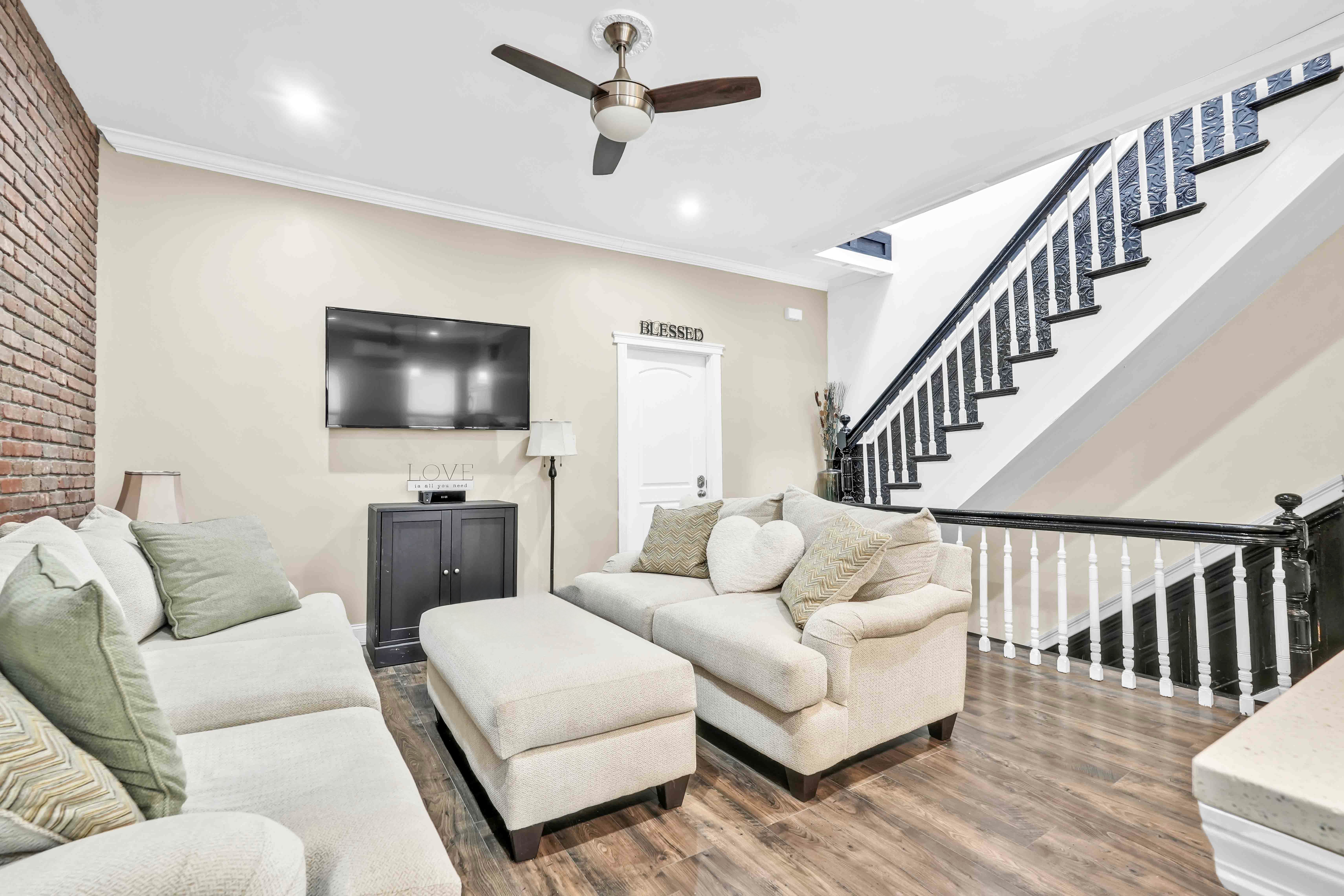 519 Monroe Street Brooklyn, NY 11221 - Photo 5 of 55 a living room with furniture and a flat screen tv
