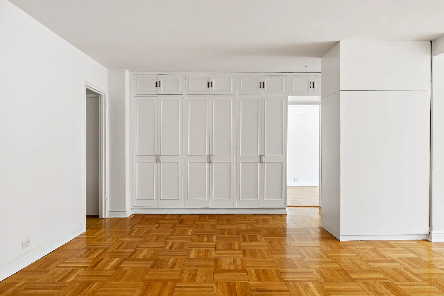a view of a livingroom with wooden floor