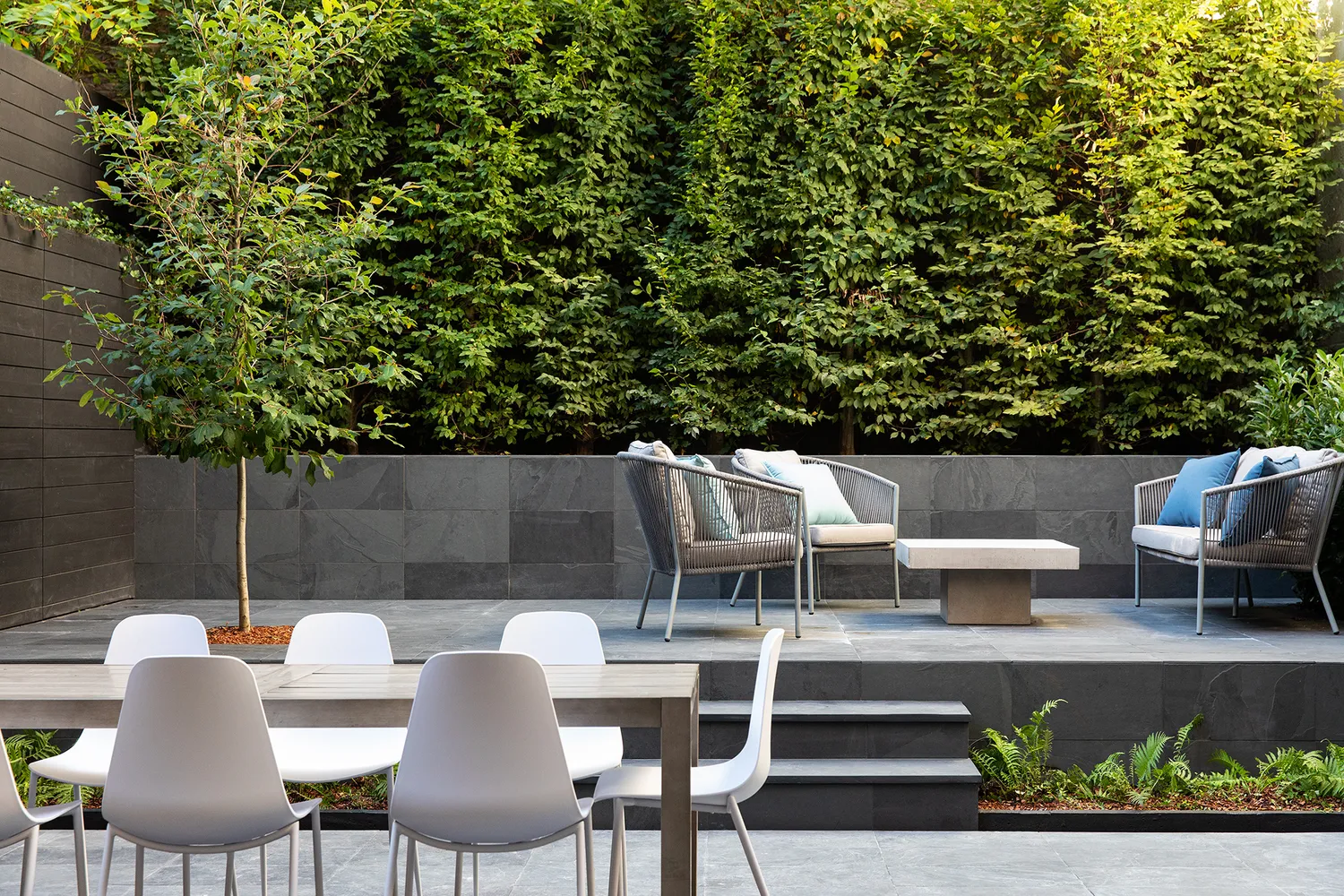 a view of a chairs and table in a patio