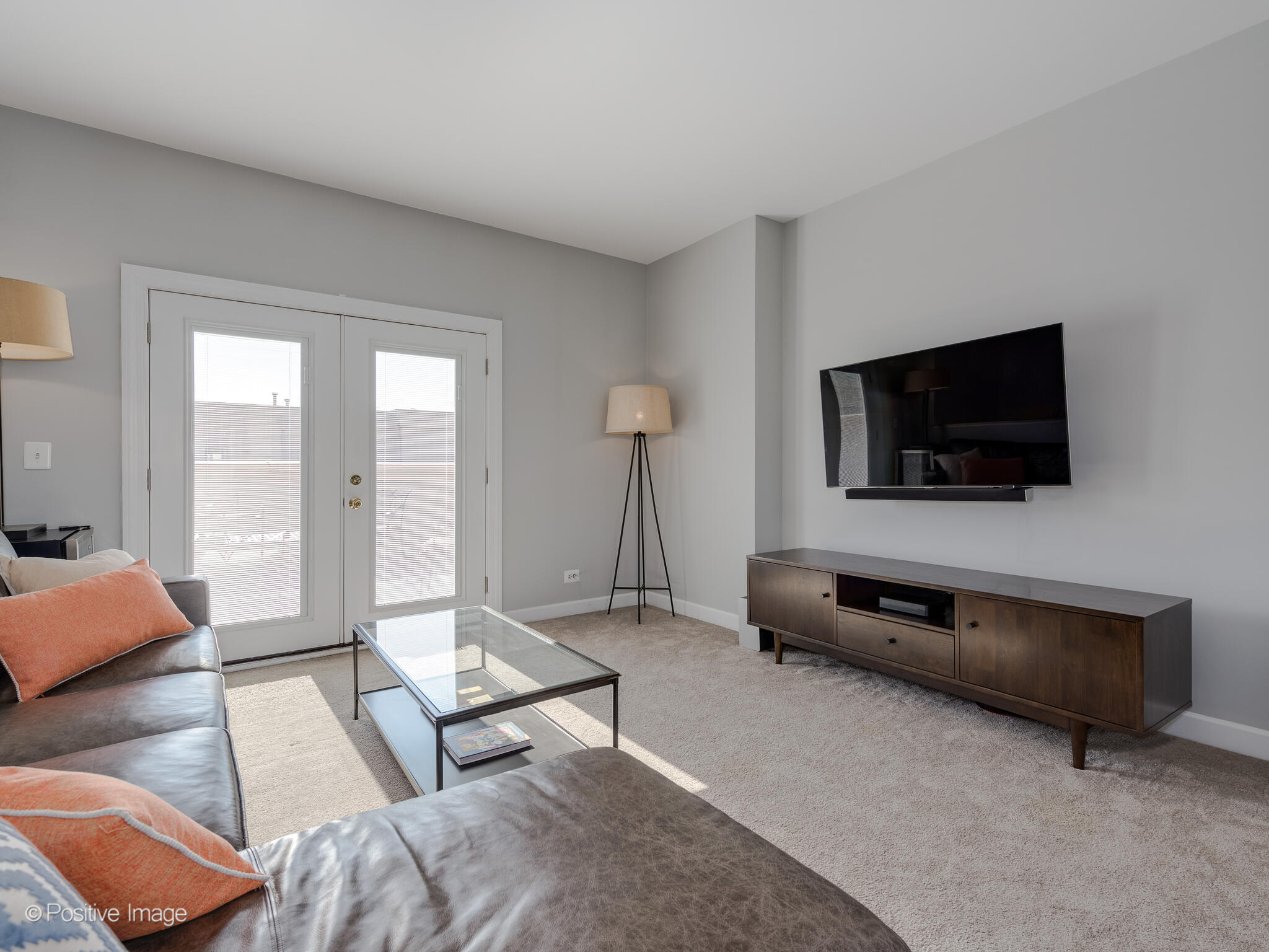 855 North May Street, Unit G Chicago, IL 60642 - Photo 24 of 28 a living room with furniture and a flat screen tv