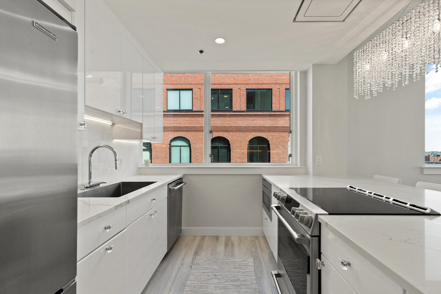 234 Causeway Street, Unit 709 Boston, MA 02114 - Photo 8 of 28 a kitchen that has a sink and a stove