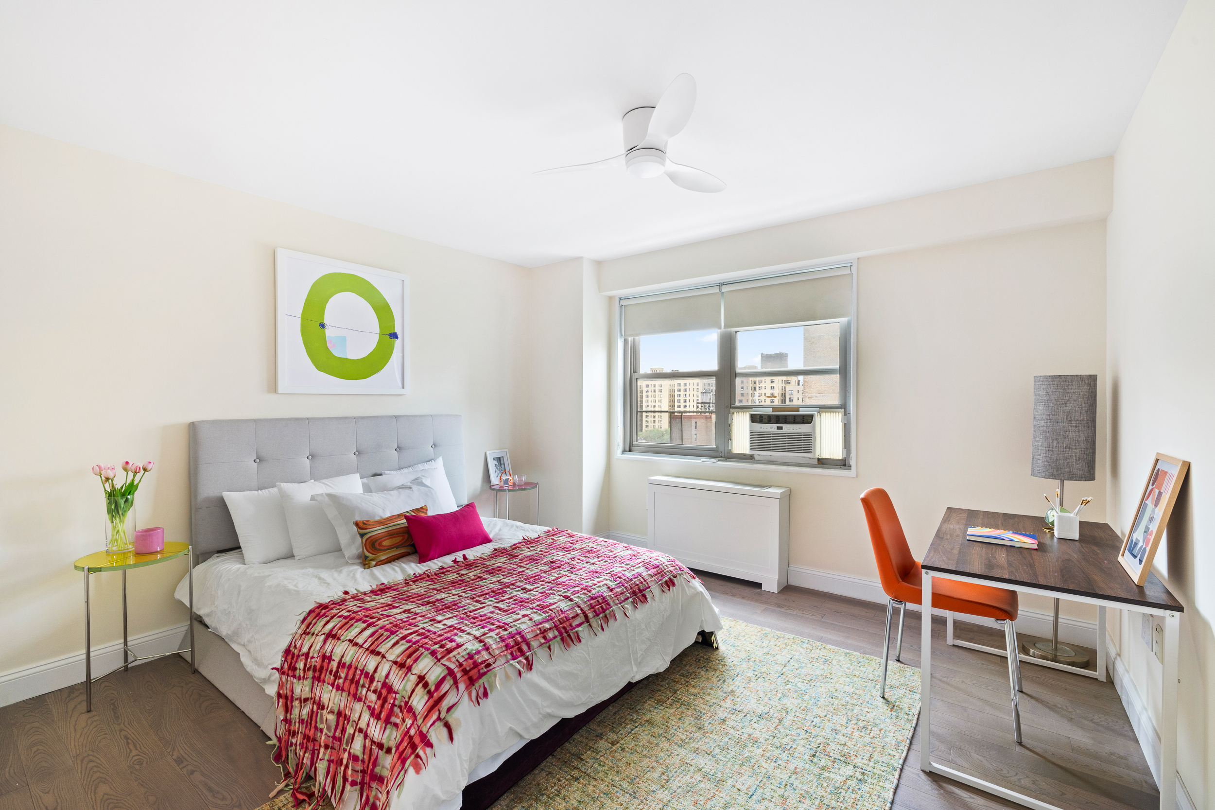 100 West 93rd Street, Unit 11J Manhattan, NY 10025 - Photo 6 of 13 a bedroom with a bed and a table in it