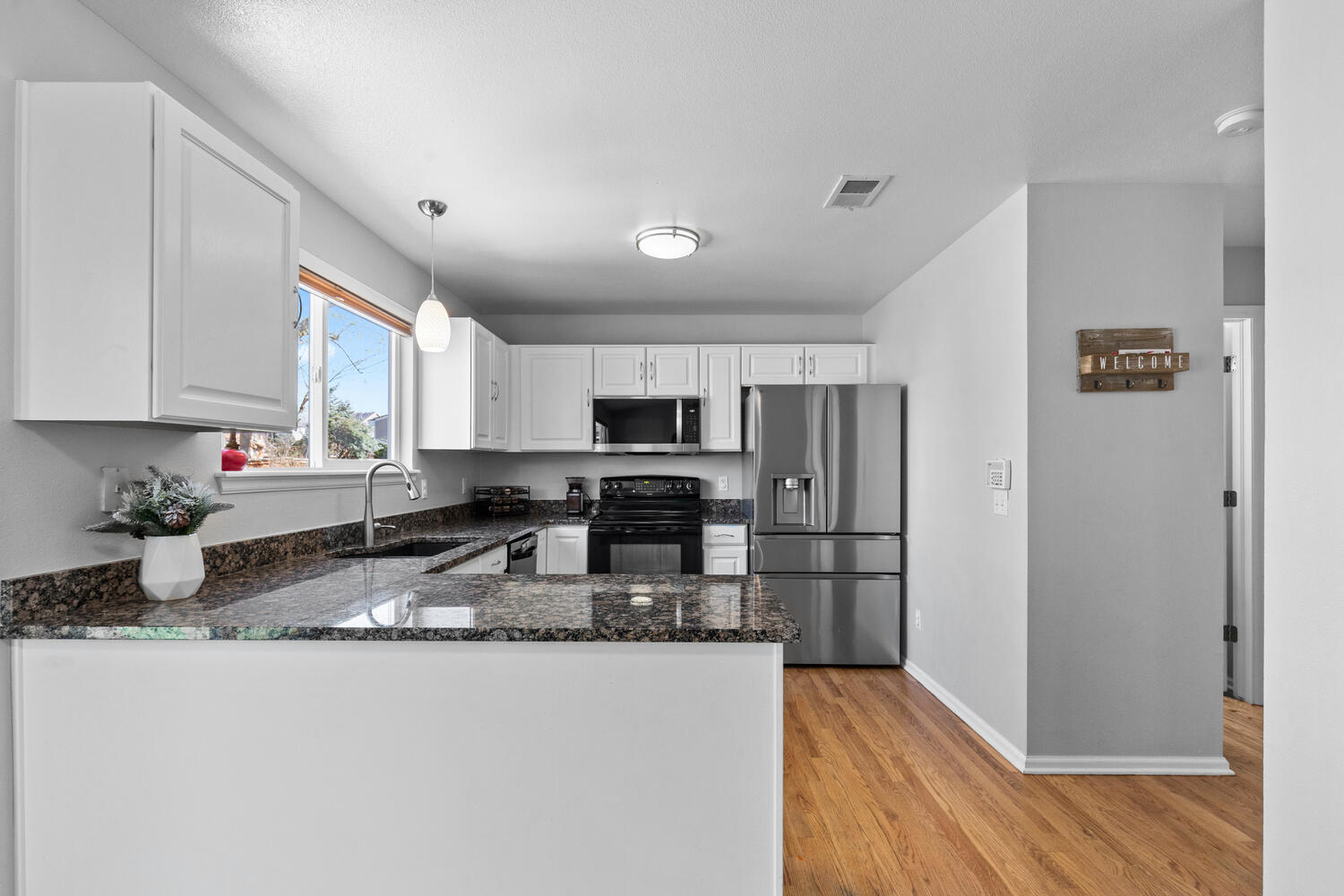 847 Timbervale Trail Highlands Ranch, CO 80129 - Photo 16 of 36 a kitchen with granite countertop a refrigerator sink and stove